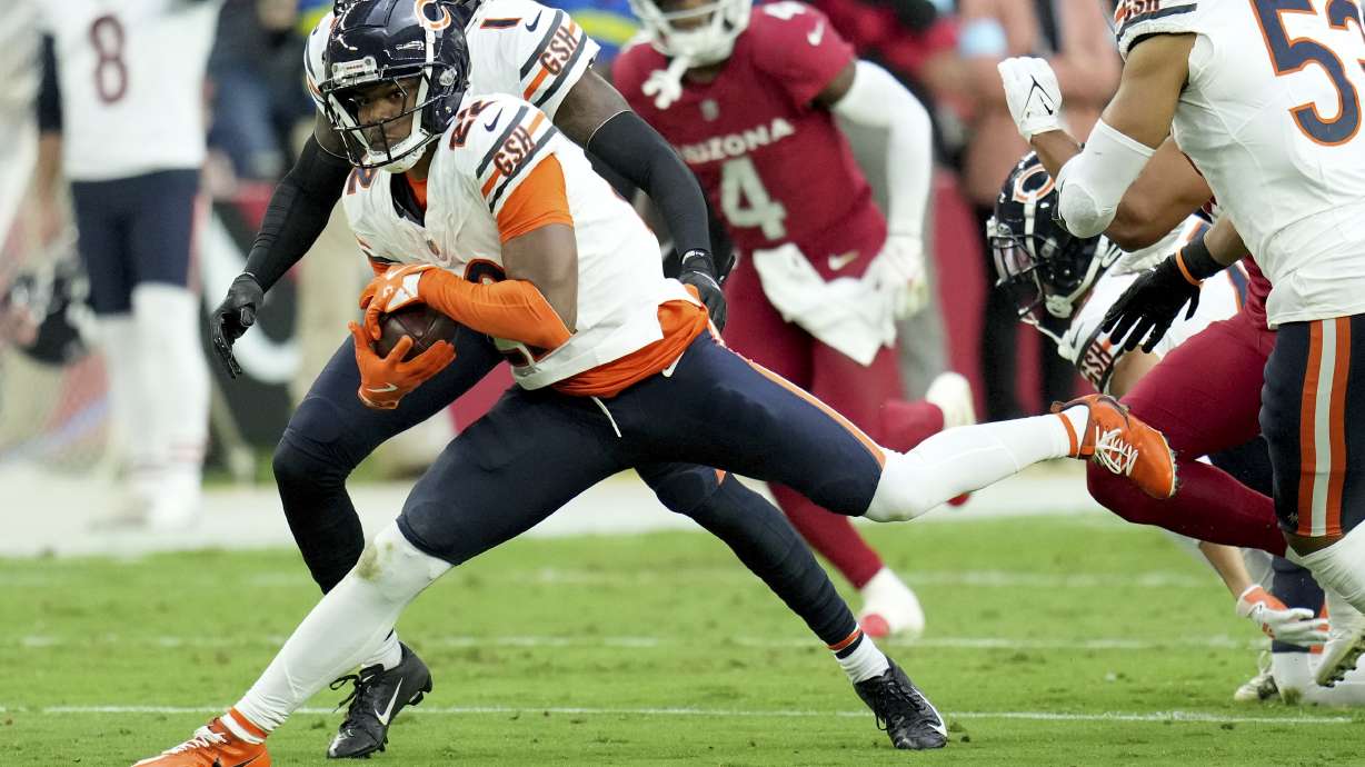 Chicago Bears wide receiver DJ Moore runs after recovering a fumble against the Arizona Cardinals during the first half of an NFL football game Sunday, Nov. 3, 2024, in Glendale, Ariz.