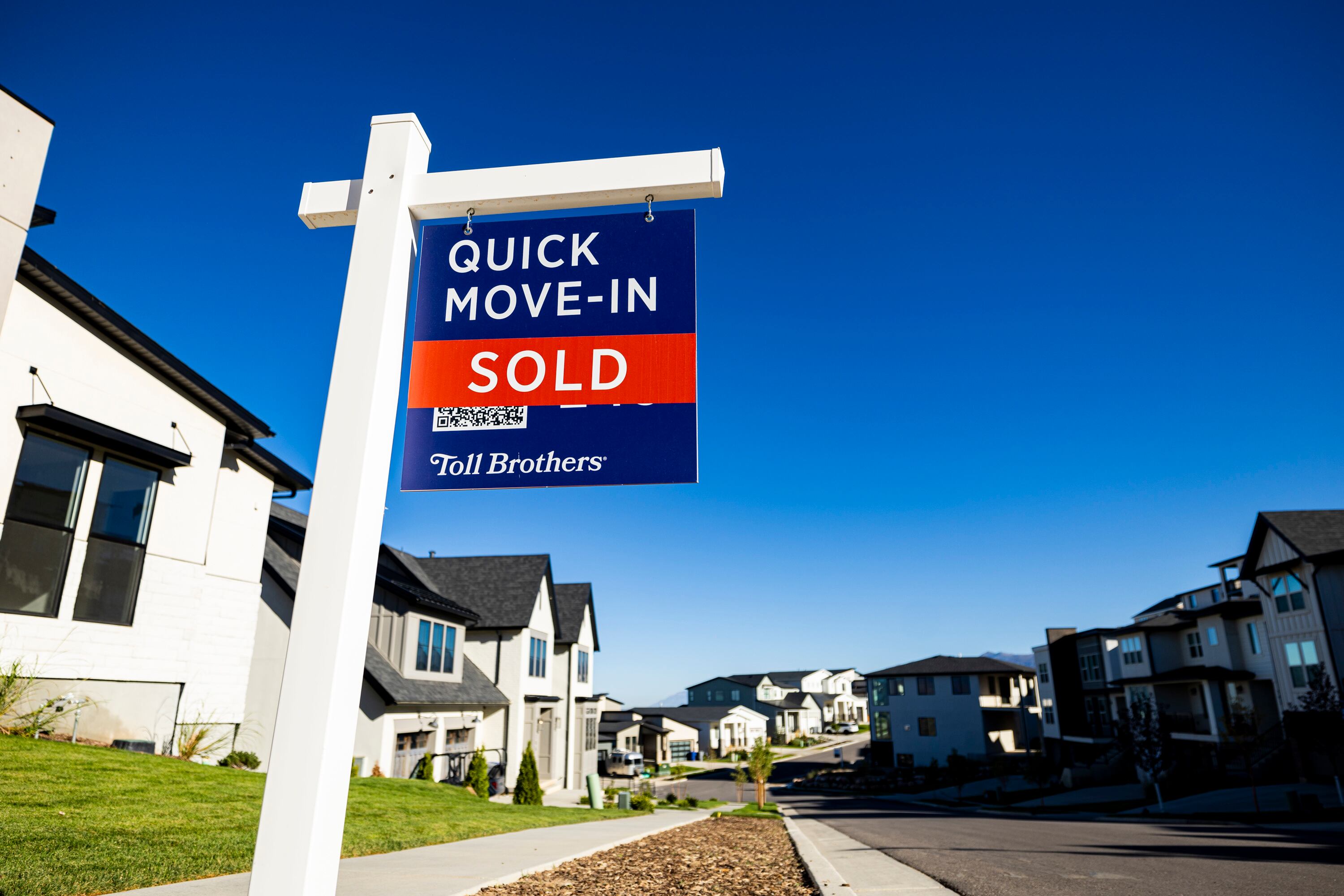 A “For Sale” sign stands among homes in North Salt Lake on Sept. 25. A robust U.S. economy is insulating mortgage rates changes from their usual connection with Federal Reserve adjustments to its benchmark interest rate.