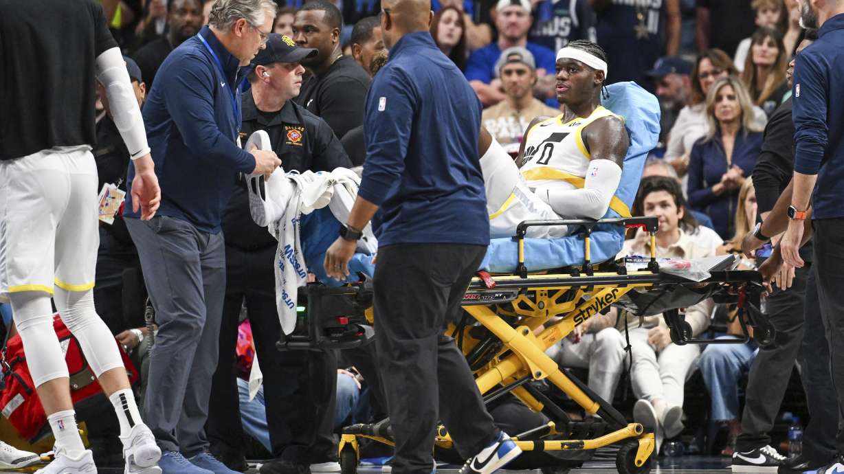 Utah Jazz forward Taylor Hendricks (0) is wheeled off by paramedics after sustaining an injury in the second half during an NBA basketball game against the Dallas Mavericks, Monday, Oct. 28, 2024, in Dallas.
