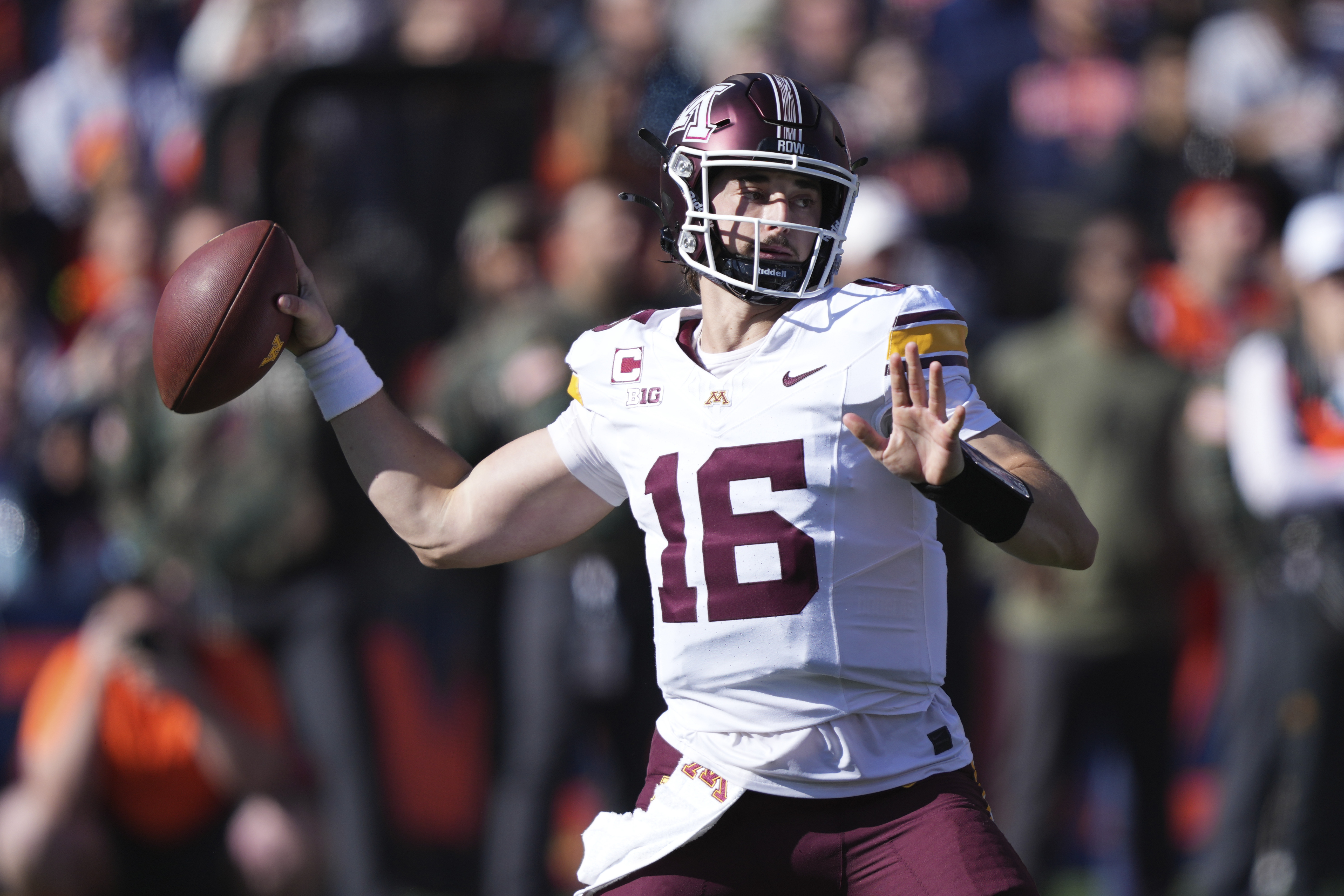 Minnesota quarterback Max Brosmer passes during the first half of an NCAA college football game against Illinois on Saturday, Nov. 2, 2024, in Champaign, Ill.