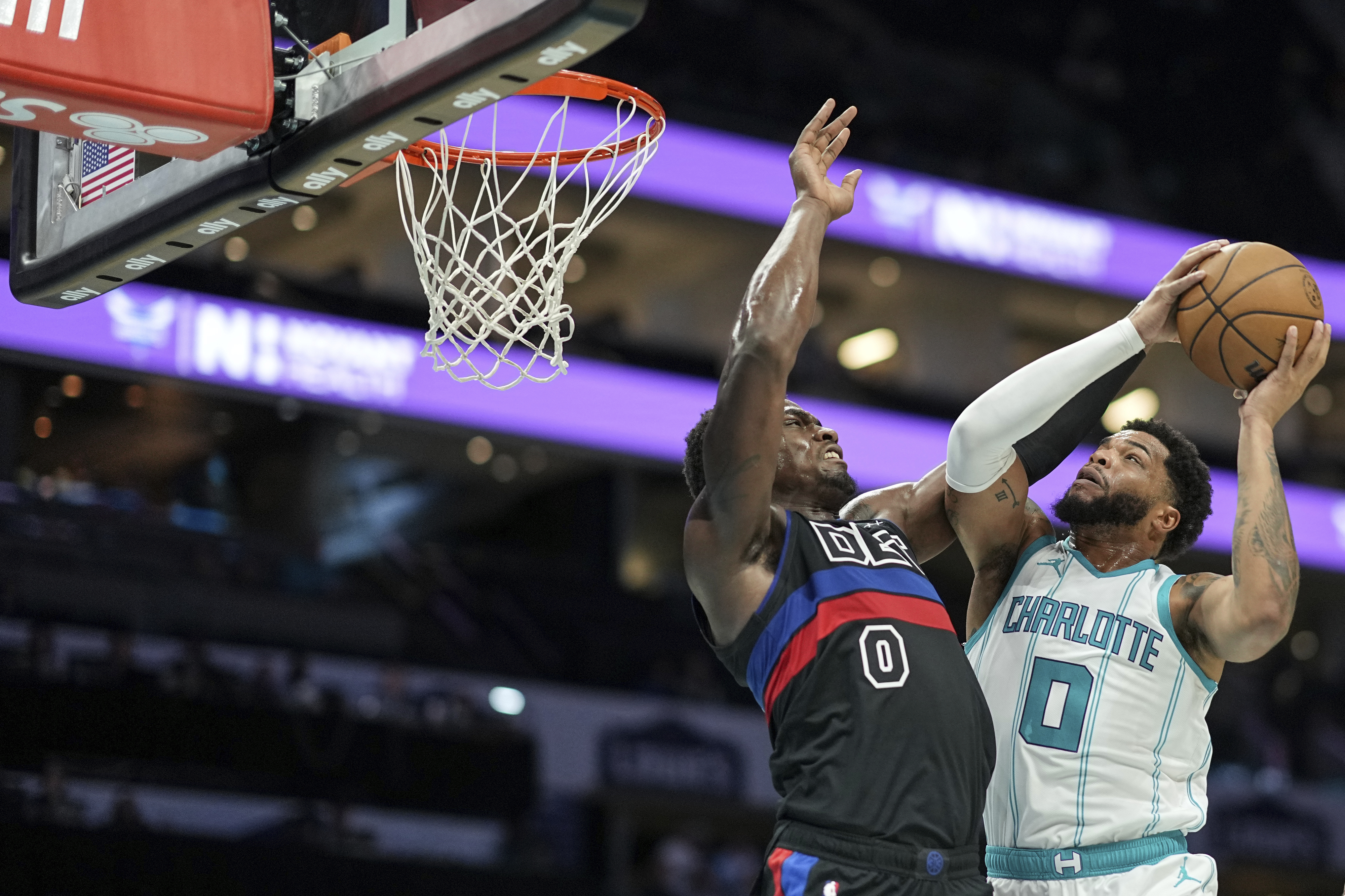 Charlotte Hornets forward Miles Bridges (0) drives to the basket against Detroit Pistons center Jalen Duren (0) during the first half of an NBA basketball game, Wednesday, Nov. 6, 2024, in Charlotte, N.C.