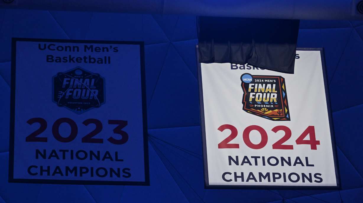 UConn's Championship banner is unveiled in a pregame ceremony before an NCAA college basketball game against Sacred Heart, Wednesday, Nov. 6, 2024, in Storrs, Conn.