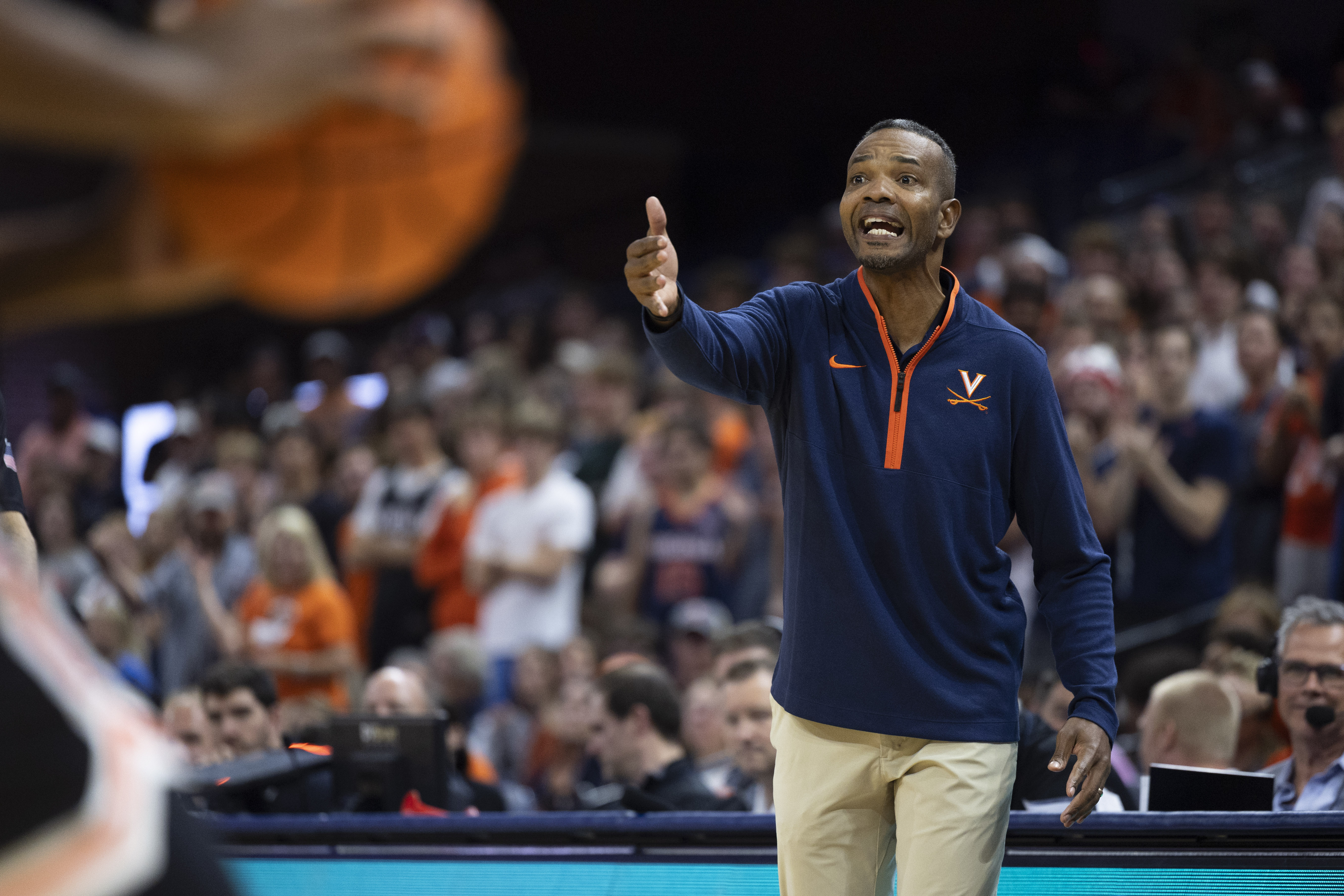 Virginia interim head coach Ron Sanchez yells to his players during the first half of an NCAA college basketball game against Campbell, Wednesday, Nov. 6, 2024, in Charlottesville, Va.