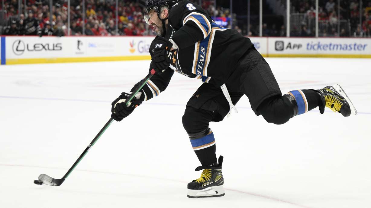 Washington Capitals left wing Alex Ovechkin (8) takes a shot during the first period of an NHL hockey game against the Nashville Predators, Wednesday, Nov. 6, 2024, in Washington.