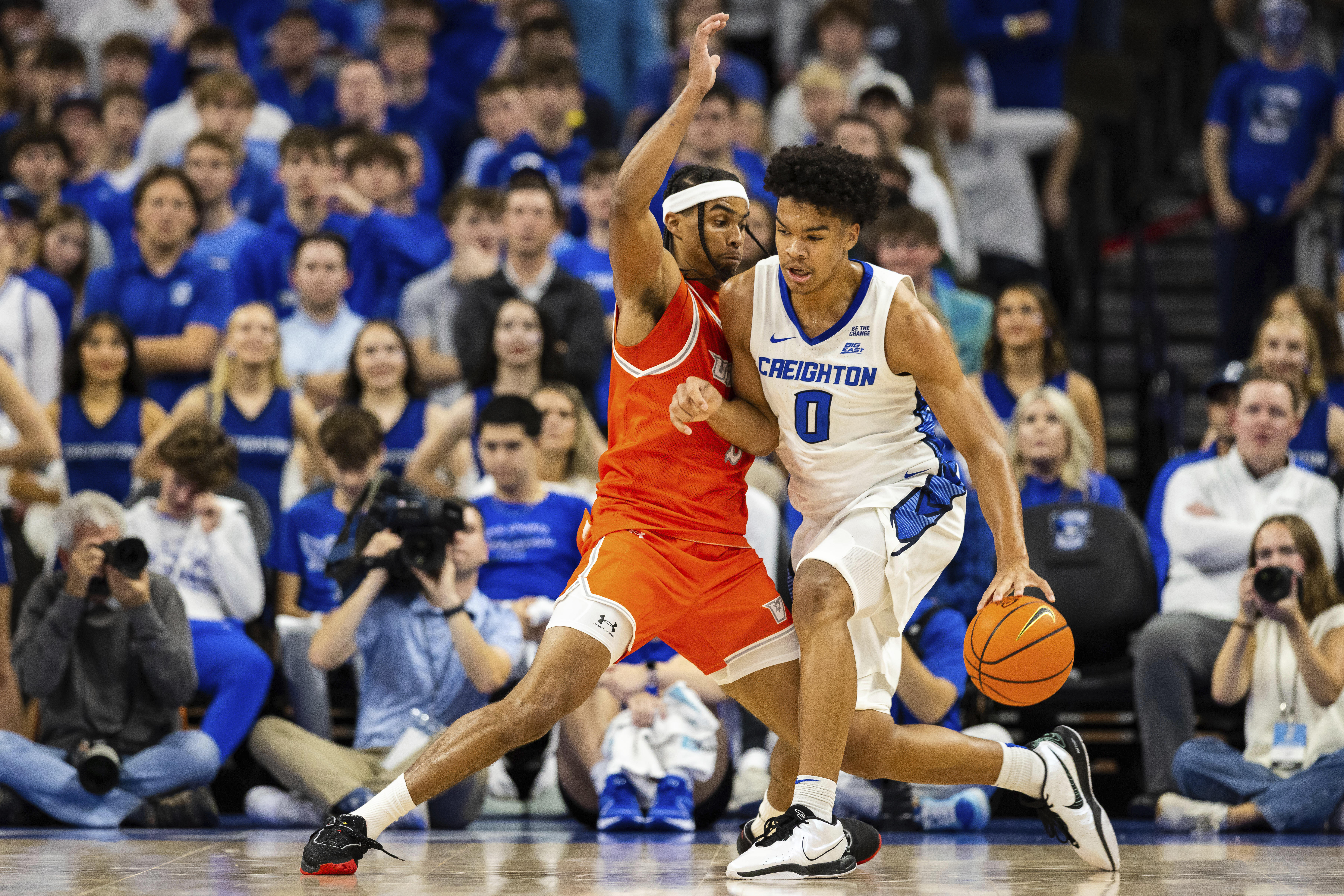 Creighton forward Jasen Green (0) drives against Texas Rio Grande Valley guard Howie Fleming Jr. (5) during the first half of an NCAA college basketball game Wednesday, Nov. 6, 2024, in Omaha, Neb.