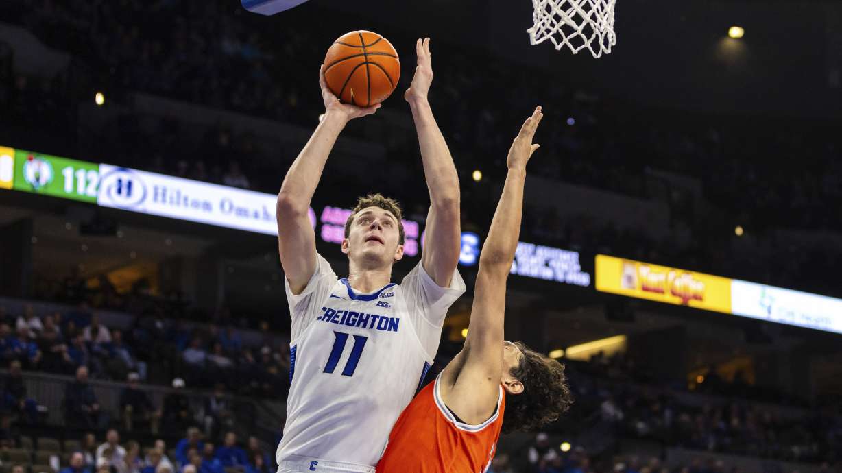 Creighton center Ryan Kalkbrenner (11) shoots against Texas Rio Grande Valley forward Tommy Gankhuyag (33) during the second half of an NCAA college basketball game Wednesday, Nov. 6, 2024, in Omaha, Neb.