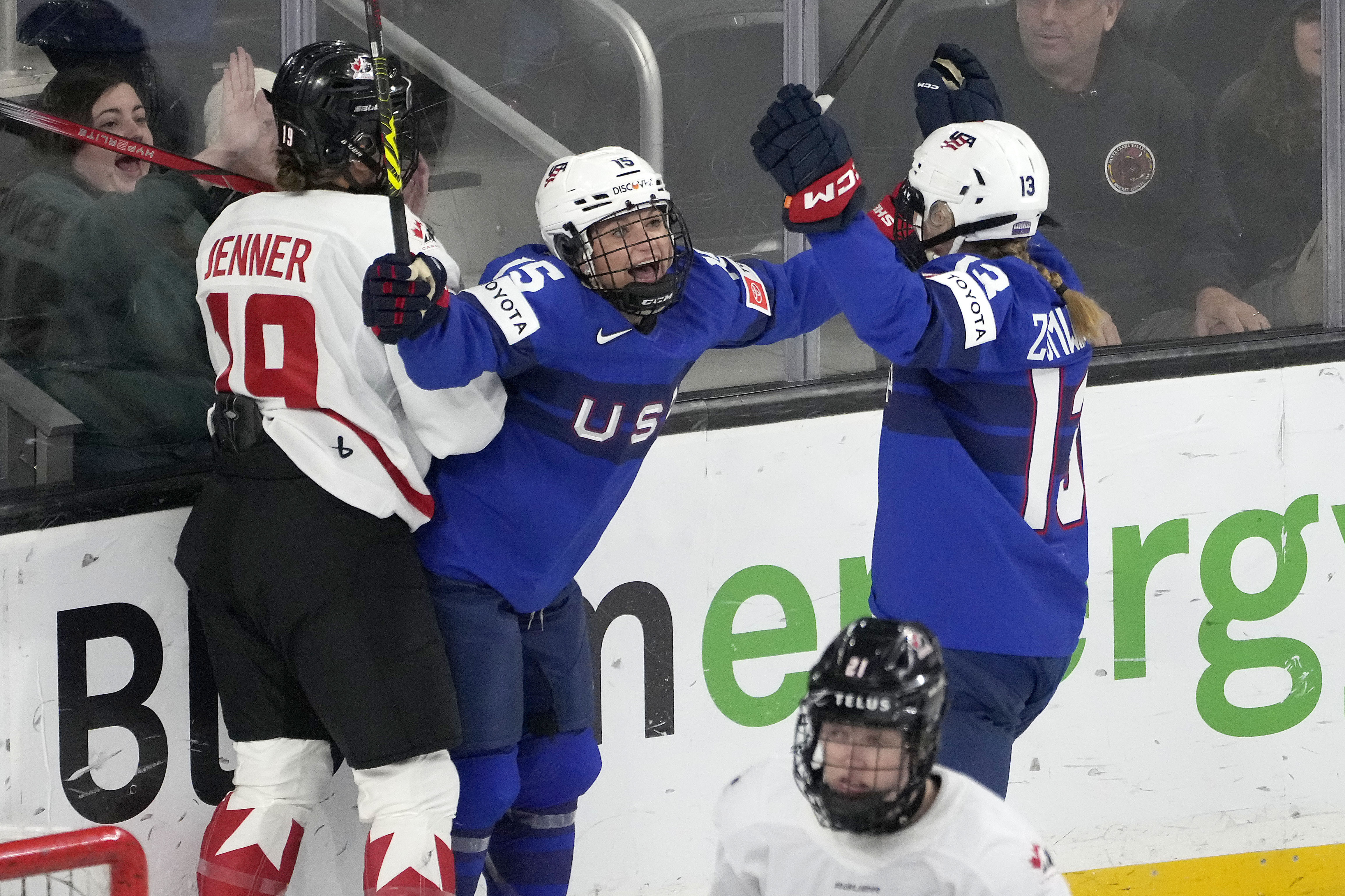 U.S. defense Savannah Harmon, center, celebrates with teammate Grace Zumwinkle (13) after scoring a goal against Canada during the first period of a women's Rivalry Series hockey game in San Jose, Calif., Wednesday, Nov. 6, 2024.