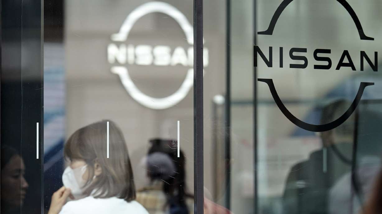 Nissan is reporting a loss for the latest fiscal quarter as its vehicle sales sank while costs and inventory ballooned.