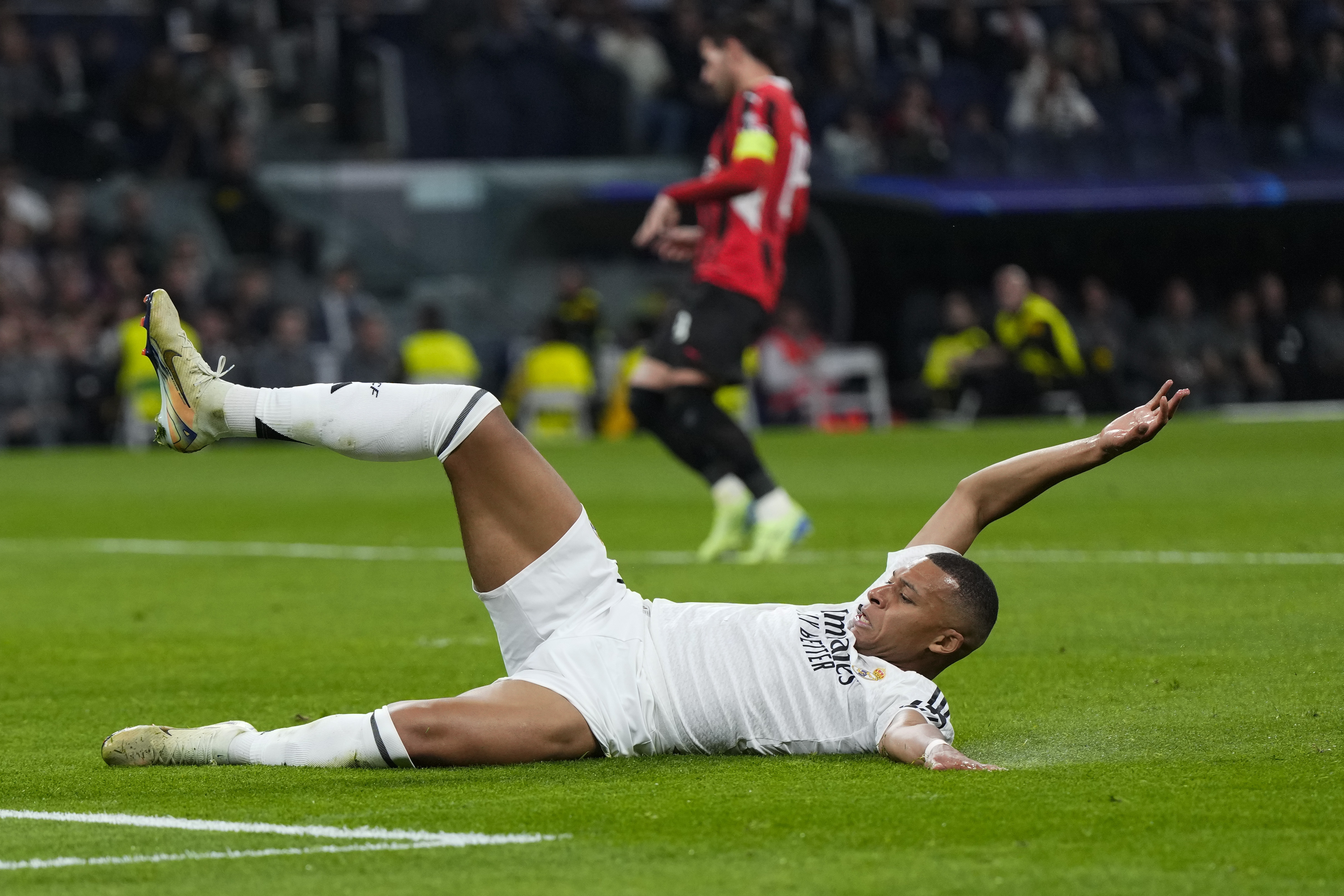 Real Madrid's Kylian Mbappe reacts during the Champions League opening phase soccer match against AC Milan at the Santiago Bernabeu stadium in Madrid, Spain, Tuesday, Nov. 5, 2024.
