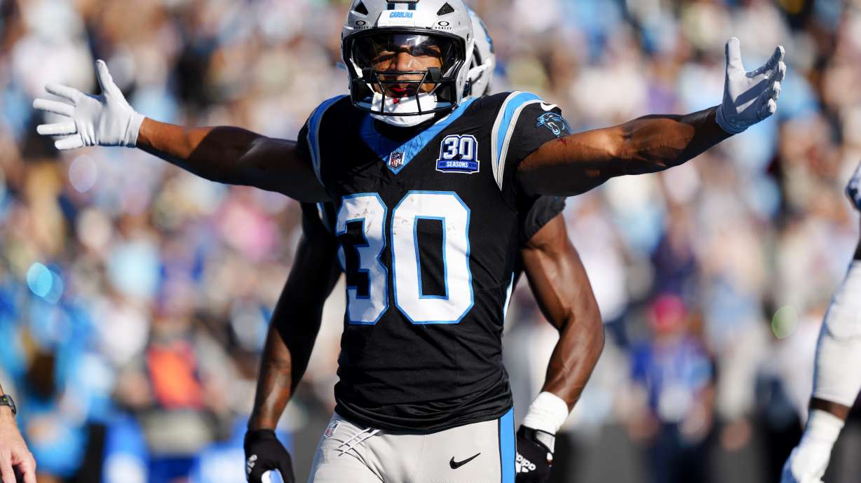 Carolina Panthers running back Chuba Hubbard celebrates after scoring against the New Orleans Saints during the second half of an NFL football game Sunday, Nov. 3, 2024, in Charlotte, N.C.