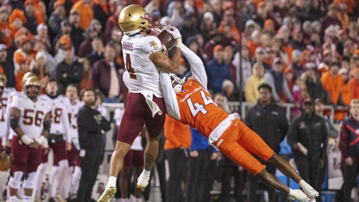 Boston College's Reed Harris catches the ball over Virginia Tech's Dorian Strong (44) during the second half of an NCAA college football game, Thursday, Oct. 17, 2024, in Blacksburg, Va.