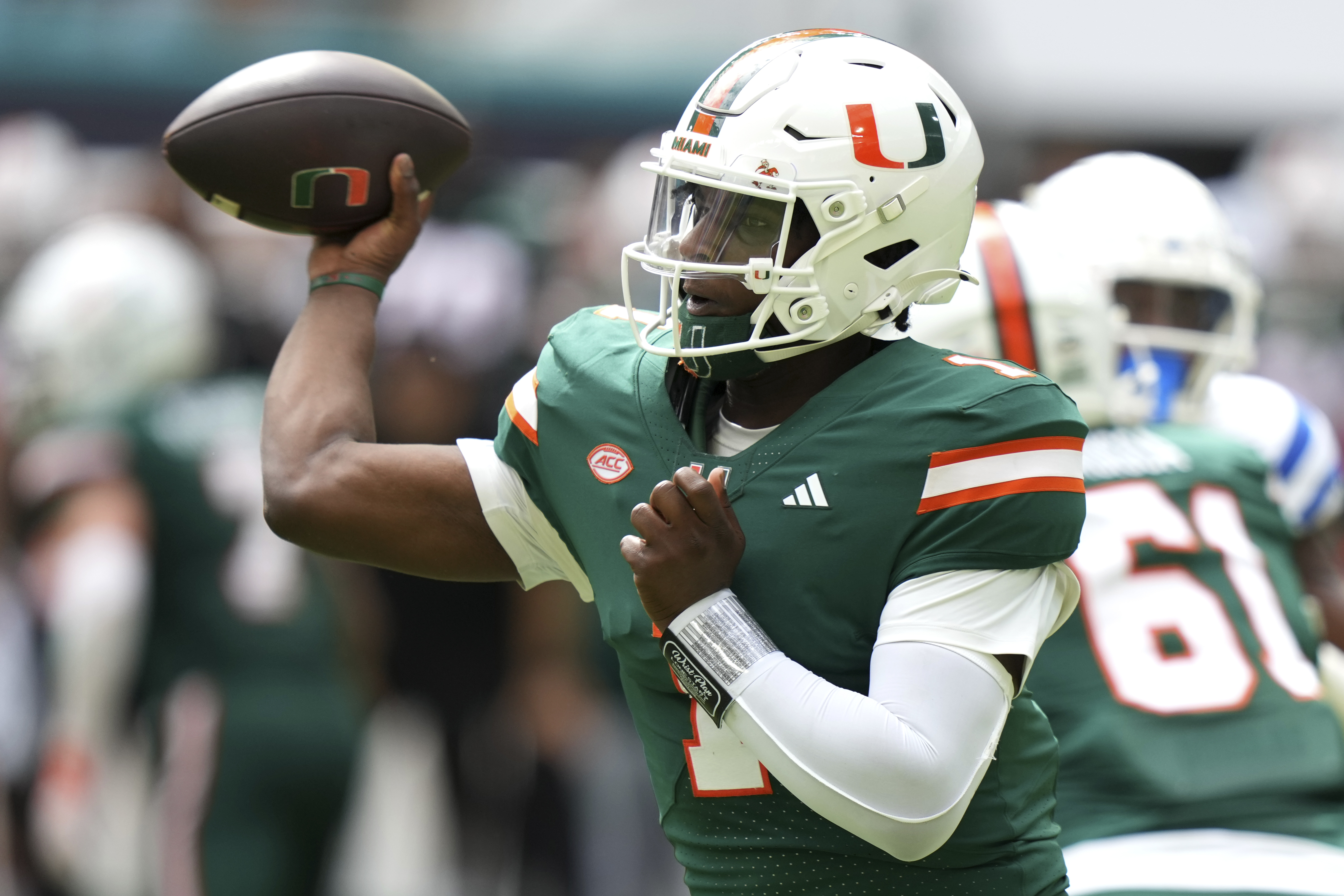 Miami quarterback Cam Ward (1) throws a pass during the first half of an NCAA college football game against Duke, Saturday, Nov. 2, 2024, in Miami Gardens, Fla.