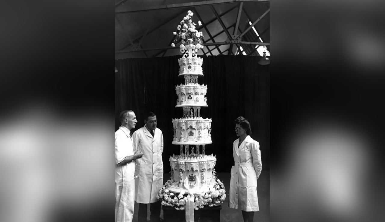 A 77-year-old slice of the 9-foot-tall cake served at Queen Elizabeth II and Prince Philip's wedding sold for $2,800 this week.