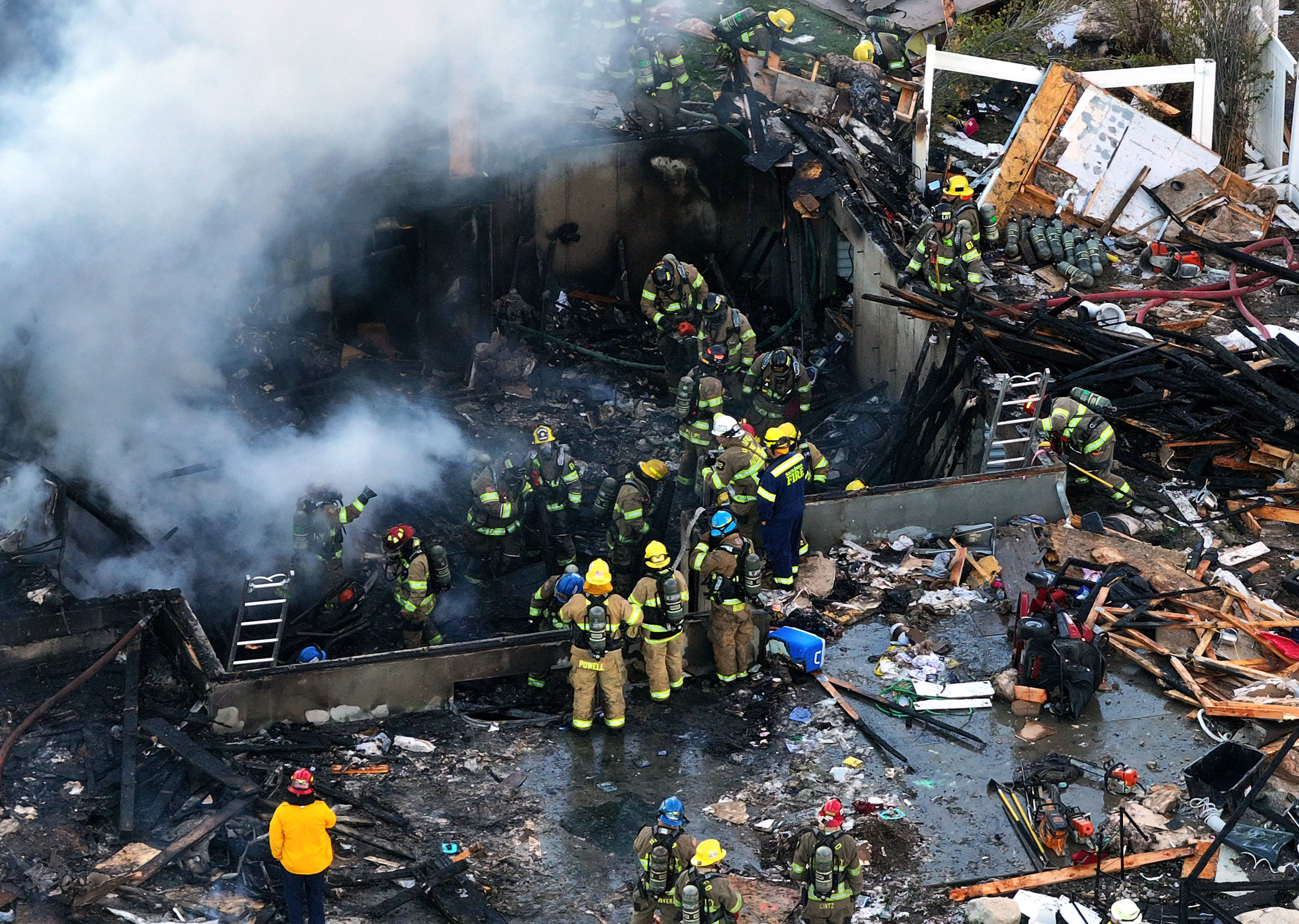 Firefighters respond to an explosion at a home in South Jordan on Nov. 6, 2024. The parents of the teen killed in the explosion have filed a wrongful death lawsuit against Enbridge Gas, claiming the company could have prevented his death.
