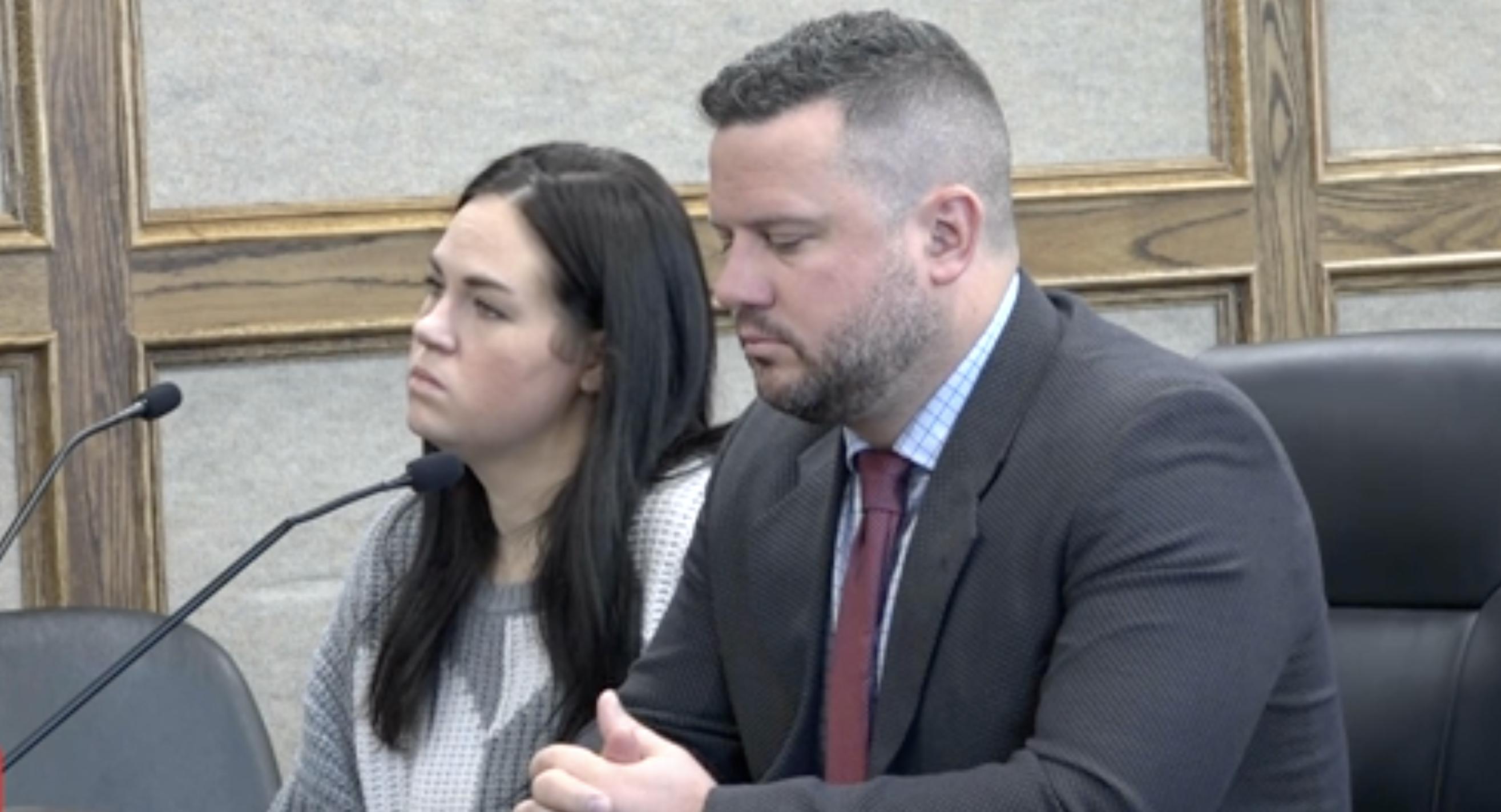 Kaitlyn Fisher, left, and her defense attorney, John Malek, attends her sentencing for charges related to embezzlement on Wednesday in Idaho Falls, Idaho.