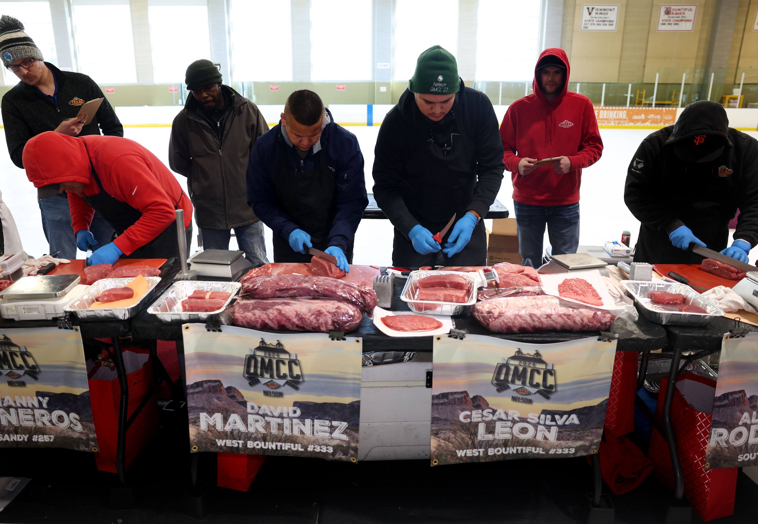 Meat cutters compete in the qualifier Meat Cutting on Ice competition at the South Davis Recreation Center in Bountiful on Thursday. Each participant receives 20-30 pounds of beef, consisting of one sirloin, one filet and one ribeye to cut. Meat cutters are judged on quality and yield in this timed cut-off. The National Meat Cutting Challenge is part of the Meat Hero program, created in 2001, to recognize daily efforts of Texas Roadhouse meat cutters.