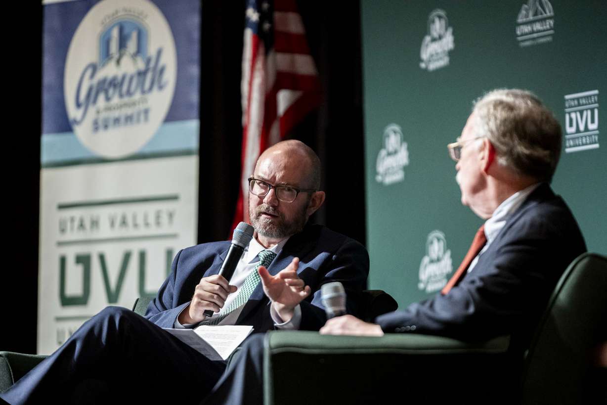 Moderator Ryan Vogel, director of the Center for National Security Studies at Utah Valley University, poses a question to former U.S. national security adviser John Bolton during the Utah Valley Growth and Prosperity Summit held at the Sorensen Student Center Grand Ballroom on the campus of UVU in Orem on Thursday.