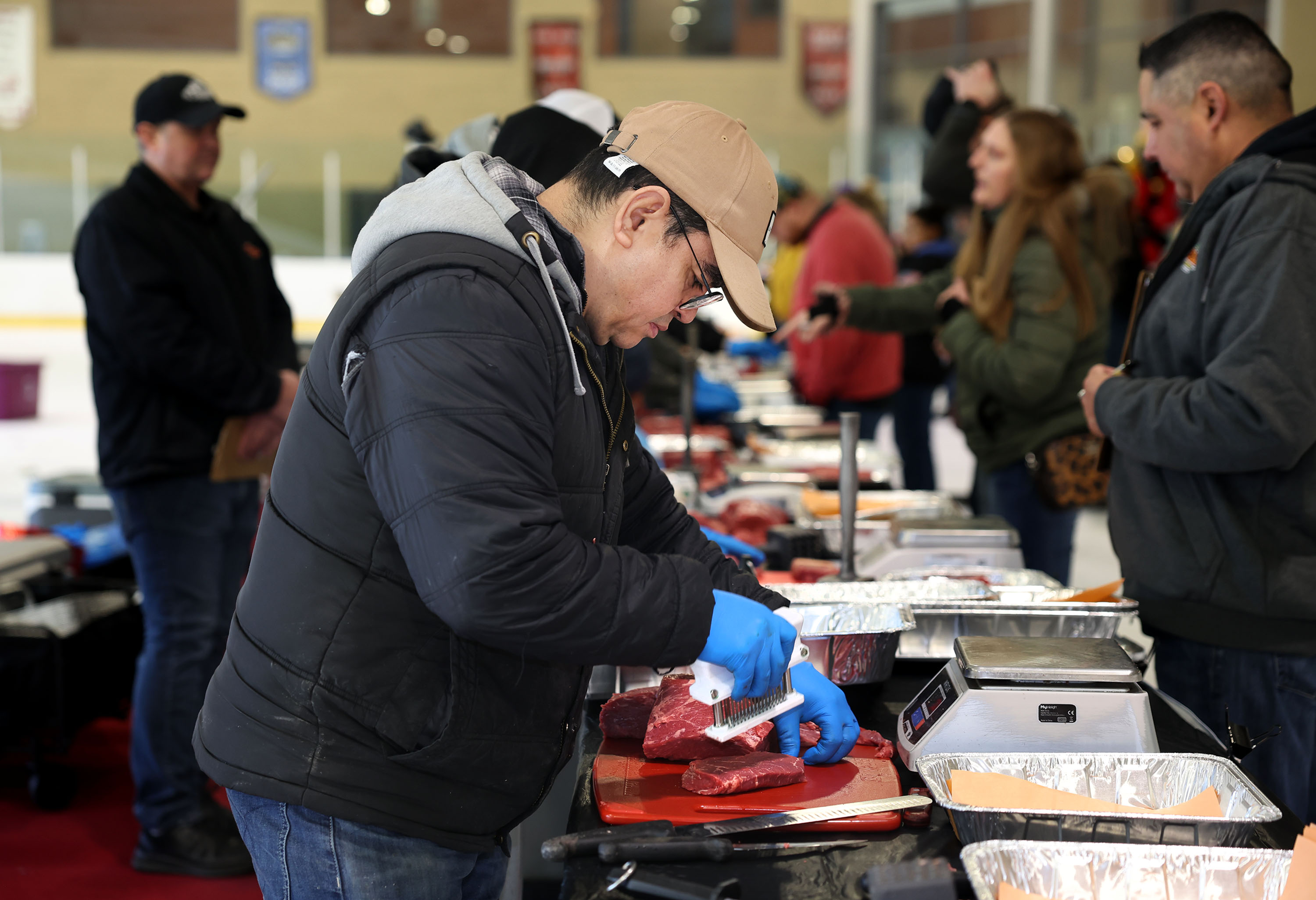 Jorge Munguia competes in the Meat Cutting on Ice competition in Bountiful at the South Davis Recreation Center on Thursday.