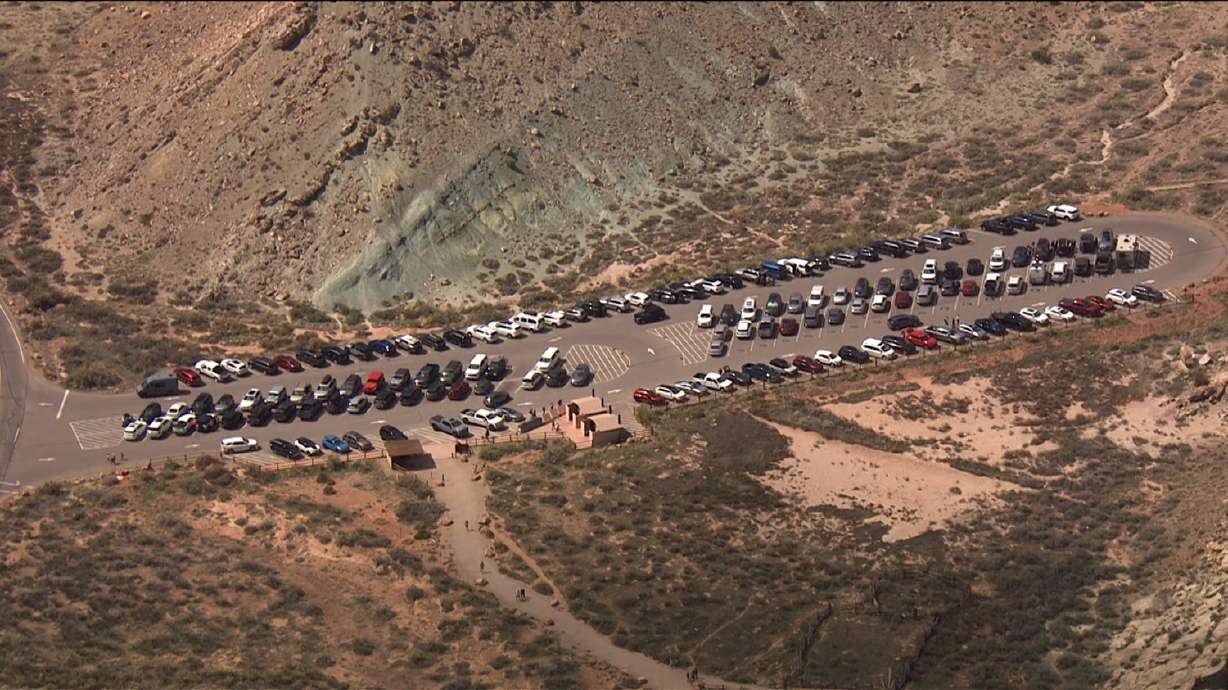 A parking lot at Arches National Park on April 1, 2024. A report released last week outlines the visitation and economic impacts of a timed-entry program implemented at Arches National Park in 2022.