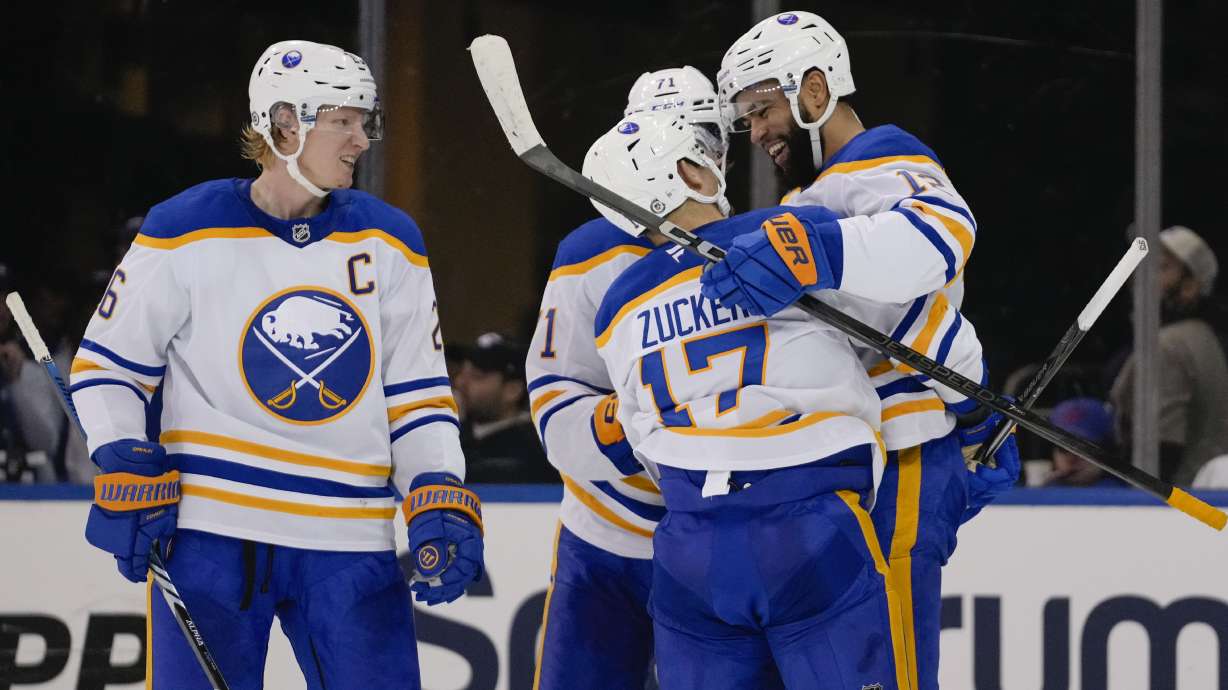 Buffalo Sabres' Jordan Greenway, right, celebrates with teammates Jason Zucker (17), Rasmus Dahlin (26) and Ryan McLeod (71) after scoring a goal during the second period of an NHL hockey game against the New York Rangers Thursday, Nov. 7, 2024, in New York.