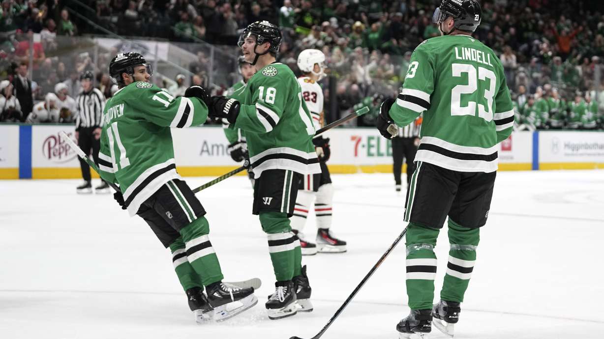 Dallas Stars' Logan Stankoven (11), Sam Steel (18) and Esa Lindell (23)j celebrate a goal scored by Steel in the first period of an NHL hockey game against the Chicago Blackhawks in Dallas, Thursday, Nov. 7, 2024.