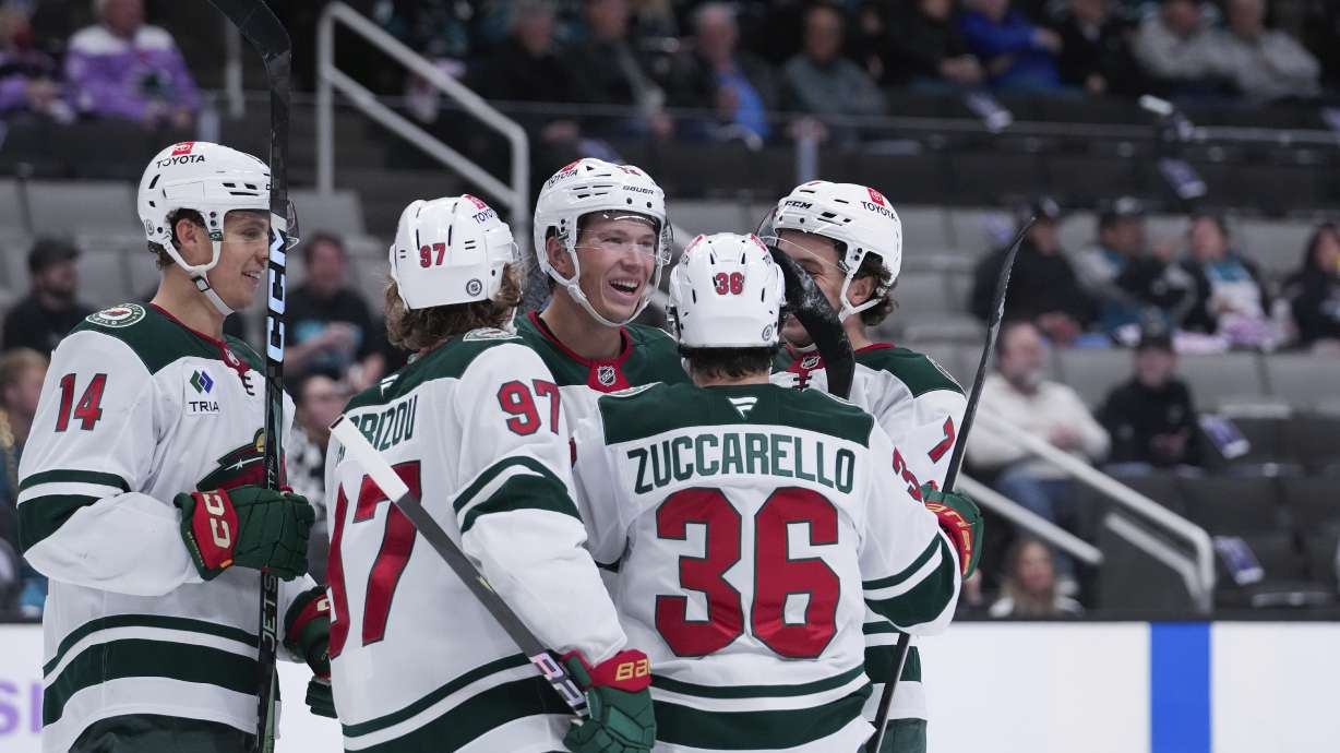 Minnesota Wild left wing Matt Boldy, center, celebrates with teammates after scoring a goal against the San Jose Sharks during the second period of an NHL hockey game Thursday, Nov. 7, 2024, in San Jose, Calif.