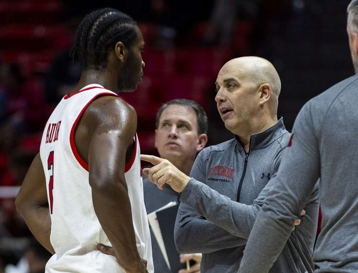 Utah Utes head coach Craig Smith talks with Utah Utes forward Ezra Ausar (2) during a game between the Utah Utes and Central Arkansas Bears at the Huntsman Center on the campus of the University of Utah in Salt Lake City on Thursday, Nov. 7, 2024.