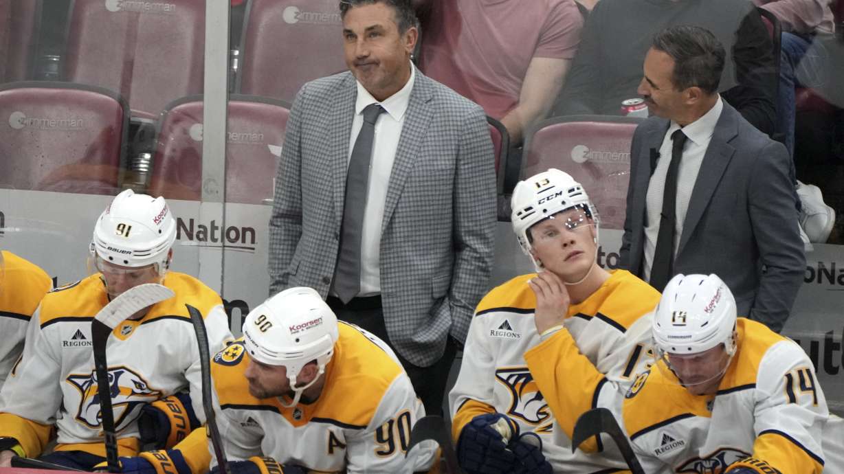 Nashville Predators head coach Andrew Brunette, left, rear, watches during the third period of an NHL hockey game against the Florida Panthers, Thursday, Nov. 7, 2024, in Sunrise, Fla.