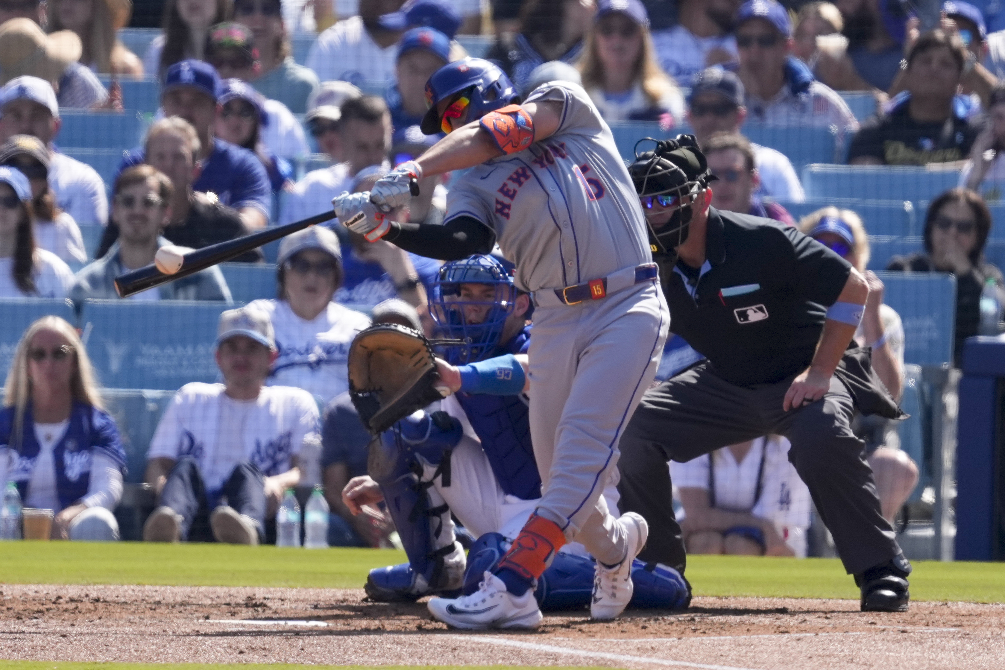 New York Mets' Tyrone Taylor hits an RBI-double against the Los Angeles Dodgers during the second inning in Game 2 of a baseball NL Championship Series, Monday, Oct. 14, 2024, in Los Angeles.