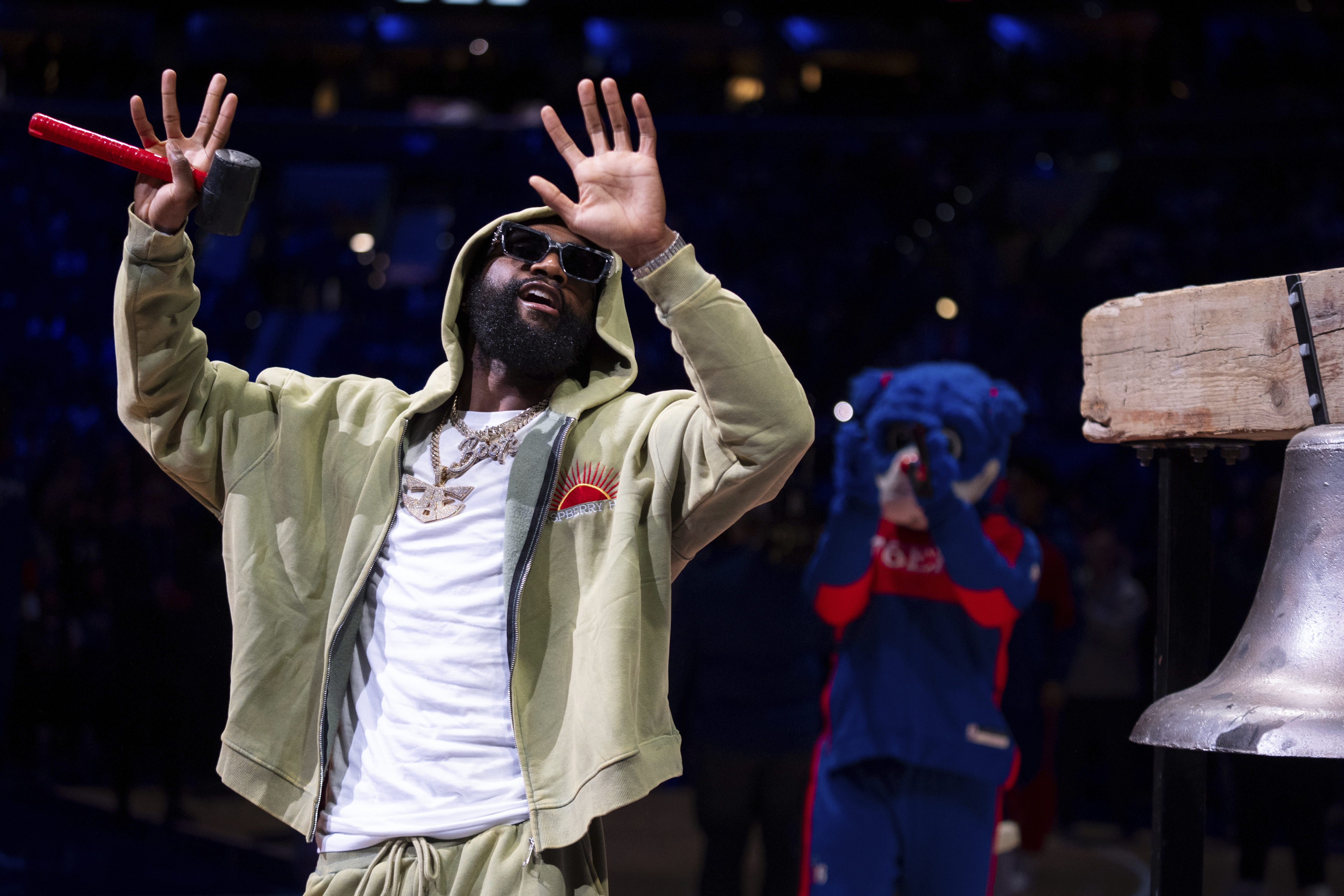 FILE - Welterweight boxer Jaron 'Boots' Ennis comes out to ring the bell prior to the NBA basketball game between the Detroit Pistons and the Philadelphia 76ers, Wednesday, Oct. 30, 2024, in Philadelphia.