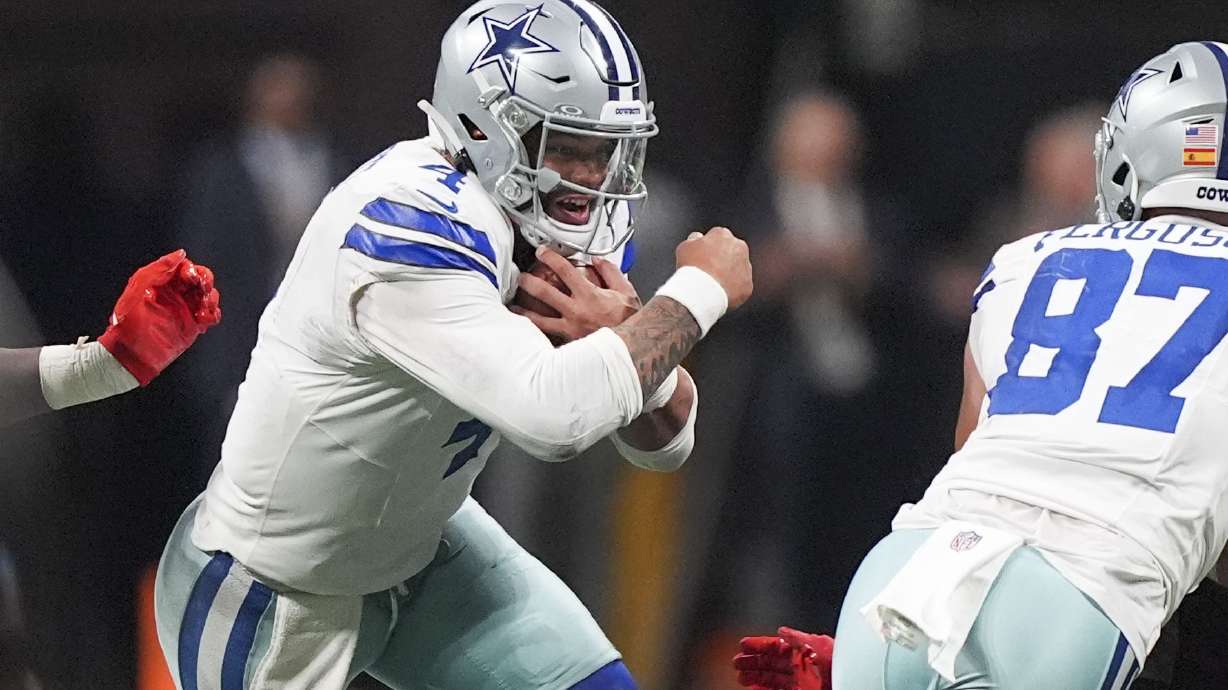 Dallas Cowboys quarterback Dak Prescott (4) carries during the second half of an NFL football game against the Atlanta Falcons, Sunday, Nov. 3, 2024, in Atlanta.