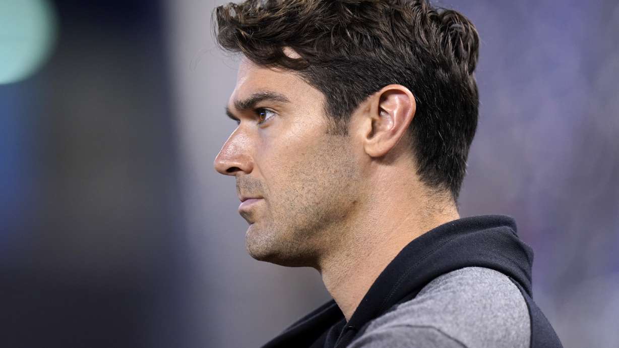 FILE - Preston Mattingly, manager of scouting for the San Diego Padres, stands on the field before a baseball game against the Miami Marlins, Saturday, July 24, 2021, in Miami.