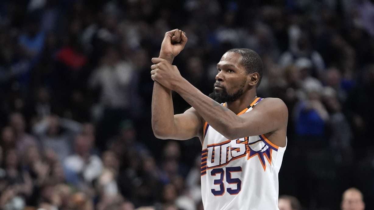Phoenix Suns forward Kevin Durant gestures for a foul called in the final second of the second half of an NBA basketball game against the Dallas Mavericks Friday, Nov. 8, 2024, in Dallas.