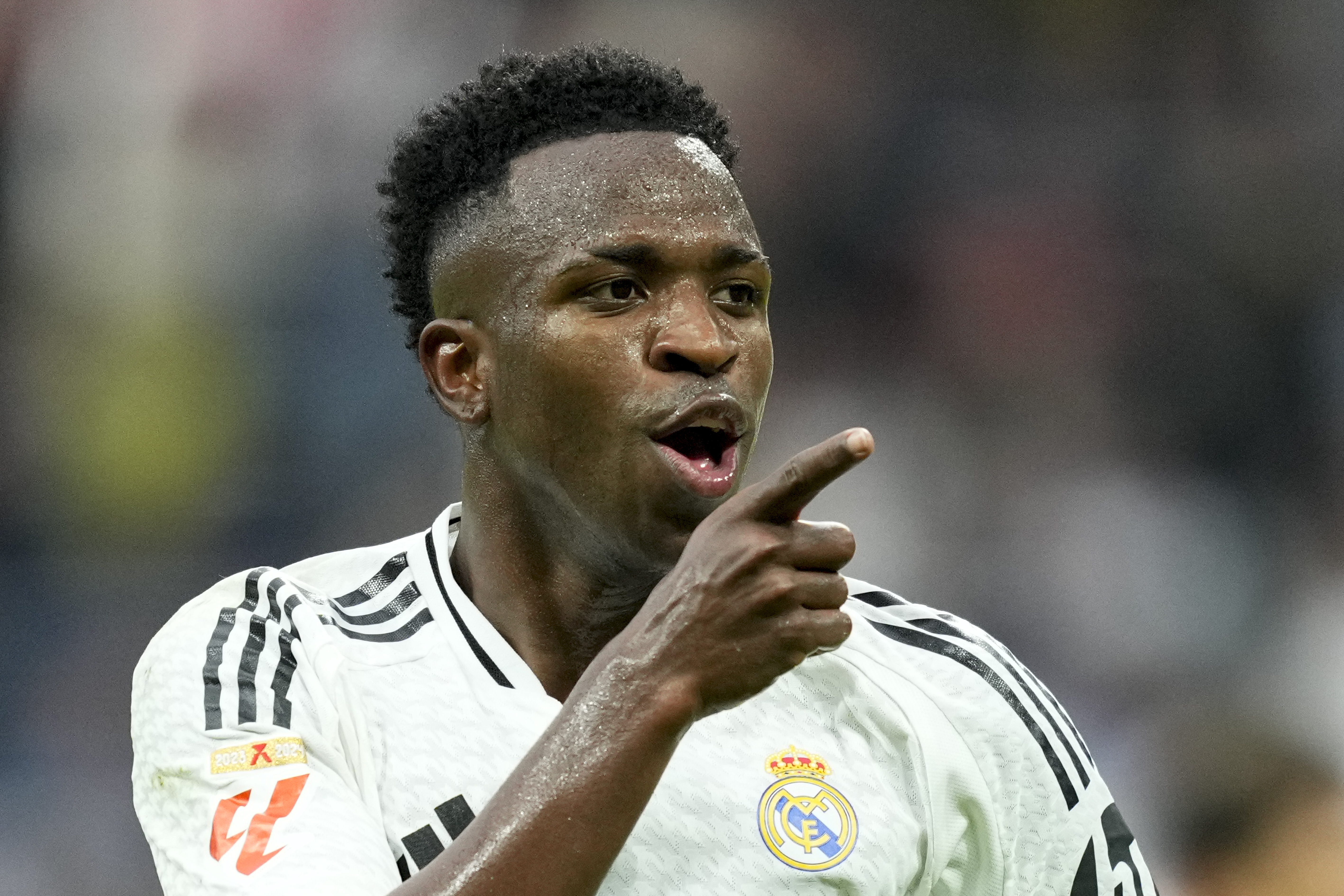 Real Madrid's Vinicius Junior celebrates after scoring his side's fourth goal during the Spanish La Liga soccer match between Real Madrid and Osasuna at the Santiago Bernabeu stadium in Madrid, Spain, Saturday, Nov. 9, 2024.