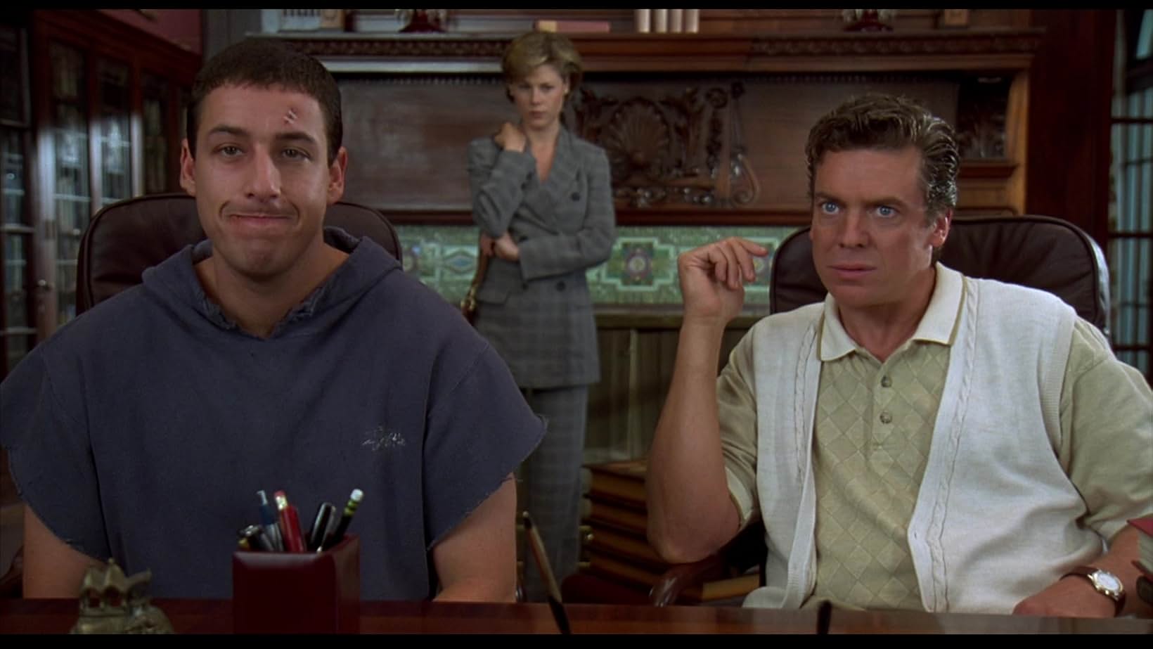 L to R: Adam Sandler as Happy Gilmore, Julie Bowen as Virginia Venit, and Christopher McDonald as Shooter McGavin in a scene from the 1996 film "Happy Gilmore."