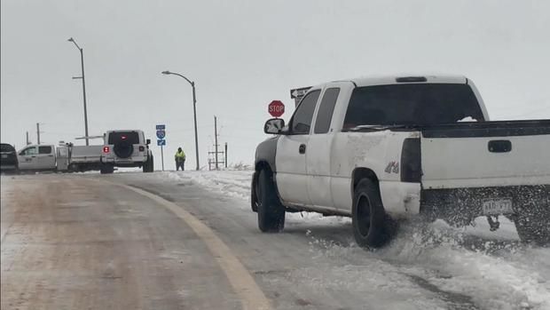 A truck spins out on an Interstate 70 ramp in eastern Colorado on Thursday. Days after taking refuge from the pounding of a winter storm, stranded travelers are looking at more trouble ahead on the Eastern Plains.