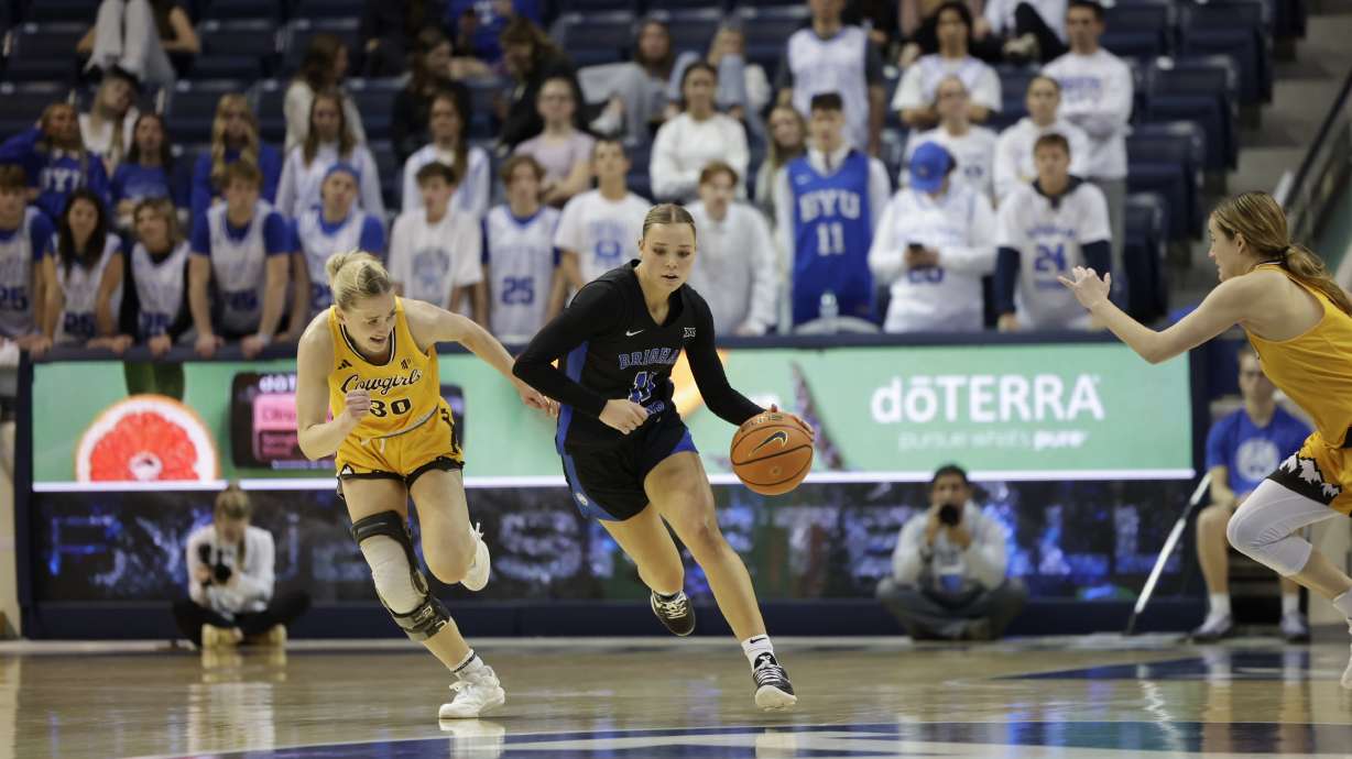 BYU guard Delaney Gibb pushes the ball up the court during an NCAA women's basketball game against Wyoming, Saturday, Nov. 9, 2024 at the Marriott Center in Provo, Utah.