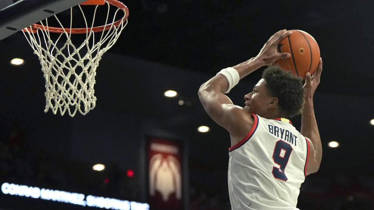 Arizona forward Carter Bryant dunks against Old Dominion during the second half of an NCAA college basketball game, Saturday, Nov. 9, 2024, in Tucson, Ariz.