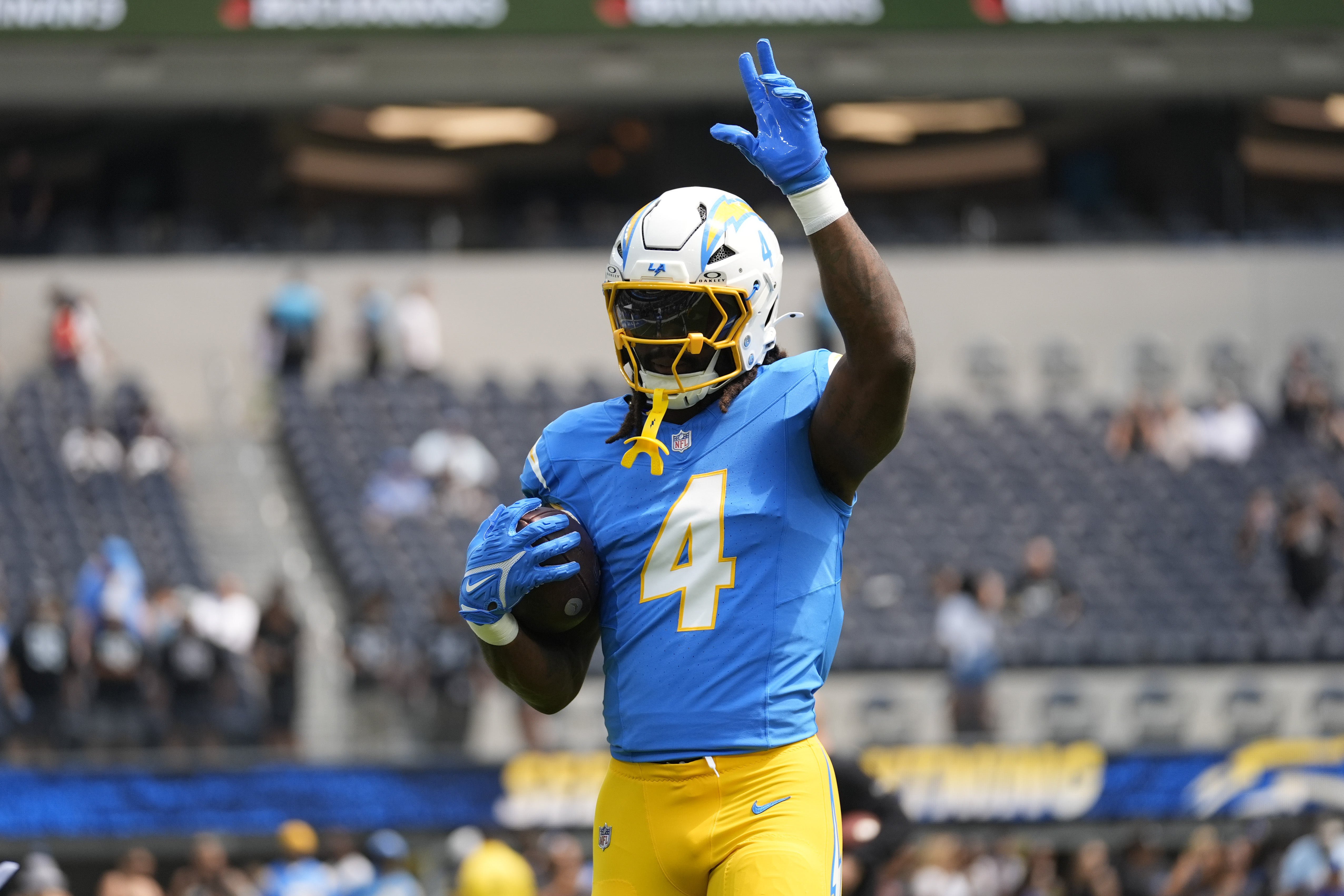 Los Angeles Chargers running back Gus Edwards works out before an NFL football game against the Las Vegas Raiders Tuesday, Sept. 10, 2024, in Inglewood, Calif.