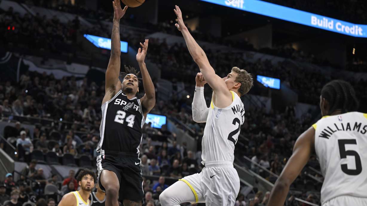 San Antonio Spurs' Devin Vassell (24) shoots against Utah Jazz's Lauri Markkanen during the first half of an NBA basketball game, Saturday, Nov. 9, 2024, in San Antonio.
