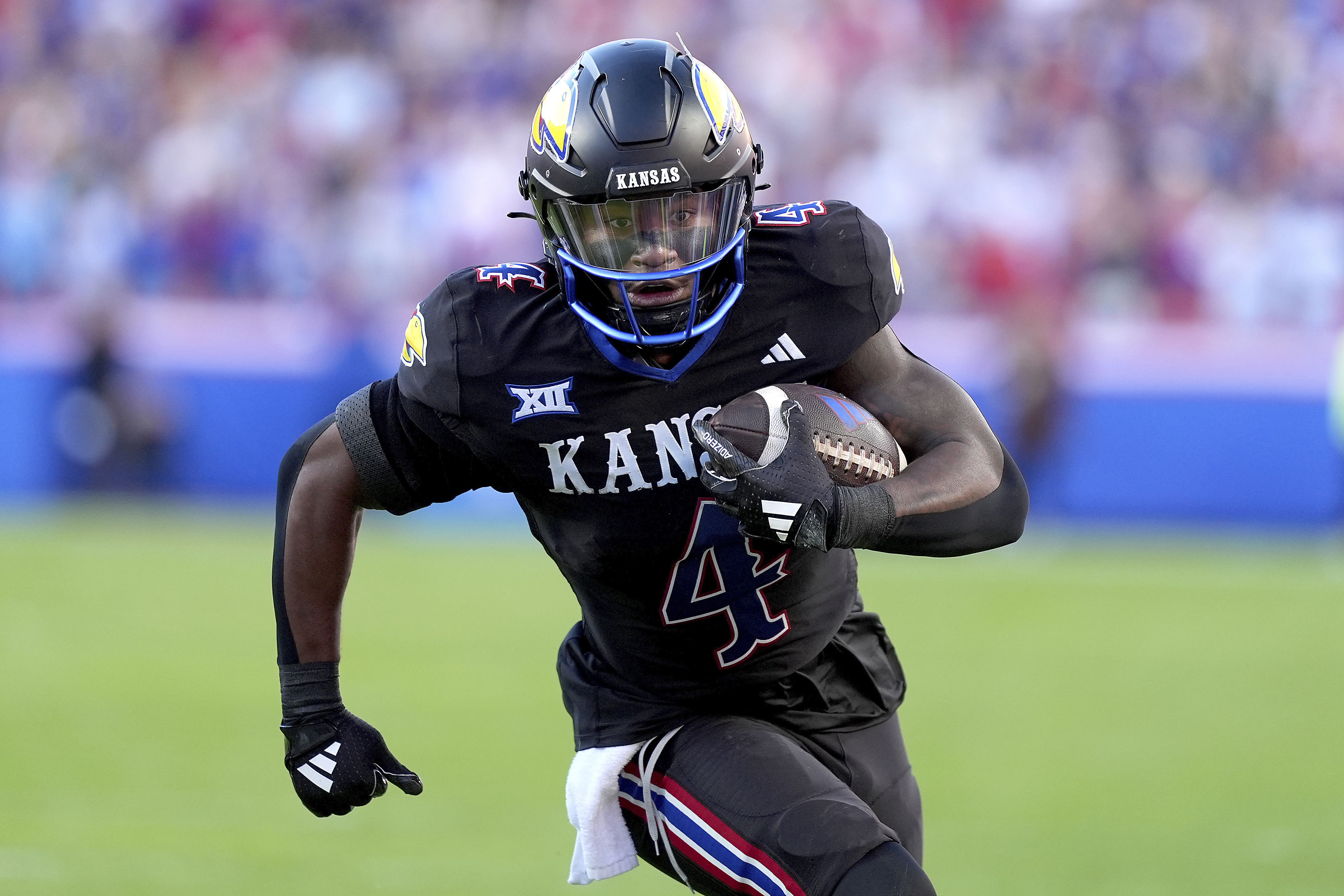 Kansas running back Devin Neal runs the ball during the first half of an NCAA college football game against Iowa State Saturday, Nov. 9, 2024, in Kansas City, Mo.