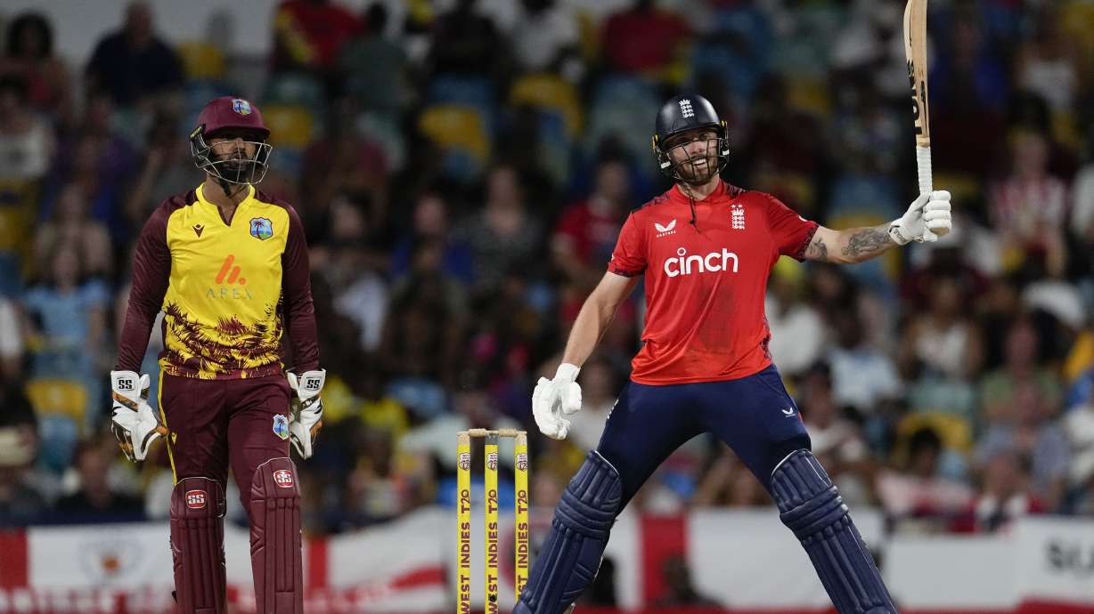 England's Phil Salt swings the bat after playing a shot against West Indies during the first T20 cricket match at Kensington Oval in Bridgetown, Barbados, Saturday, Nov. 9, 2024.
