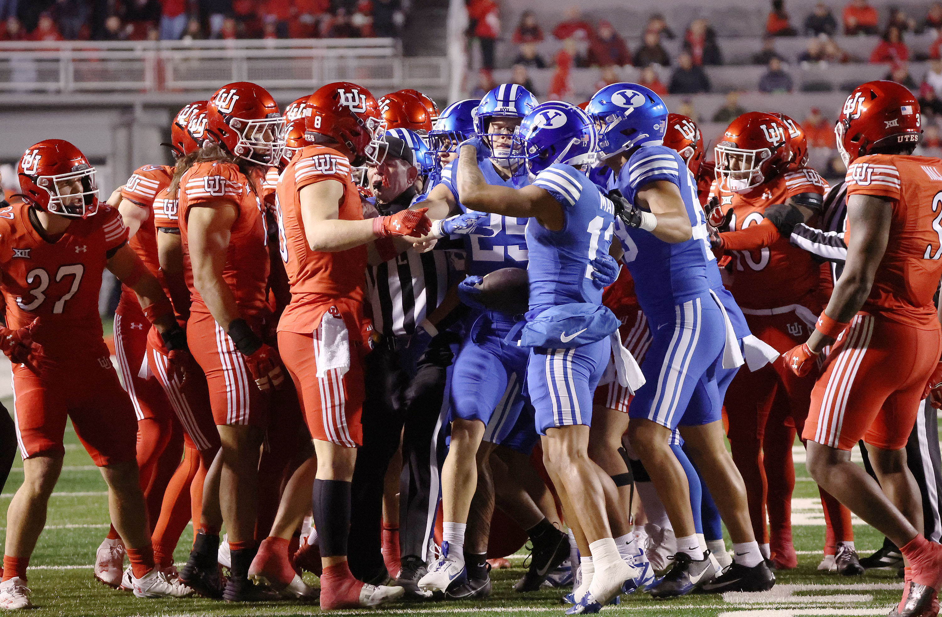 Utah Utes and Brigham Young Cougars tussle at Rice-Eccles Stadium in Salt Lake City on Saturday, Nov. 9, 2024.