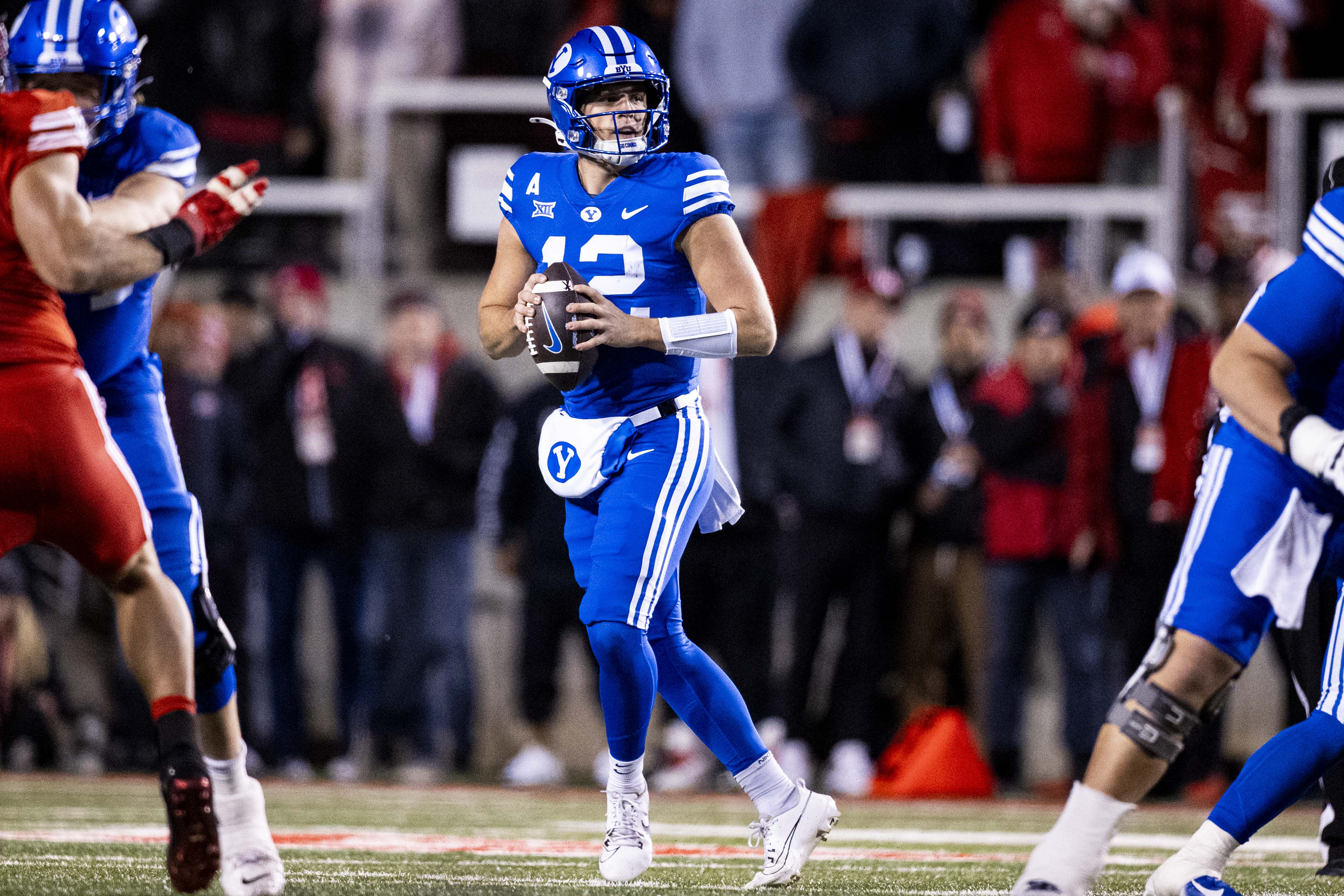 BYU quarterback Jake Retzlaff (12) looks to pass the ball during a game between the University of Utah Utes and the Brigham Young University Cougars held at Rice-Eccles Stadium in Salt Lake City on Saturday, Nov. 9, 2024.