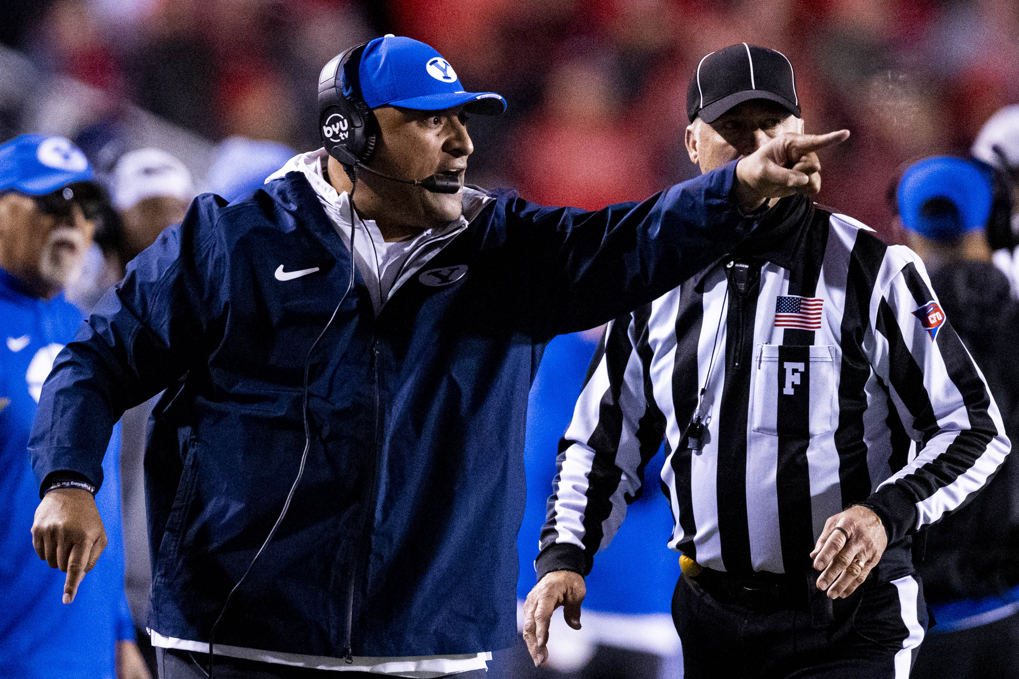 BYU football head coach Kalani Sitake calls out during a game between the University of Utah Utes and the Brigham Young University Cougars held at Rice-Eccles Stadium in Salt Lake City early on Sunday, Nov. 10, 2024.