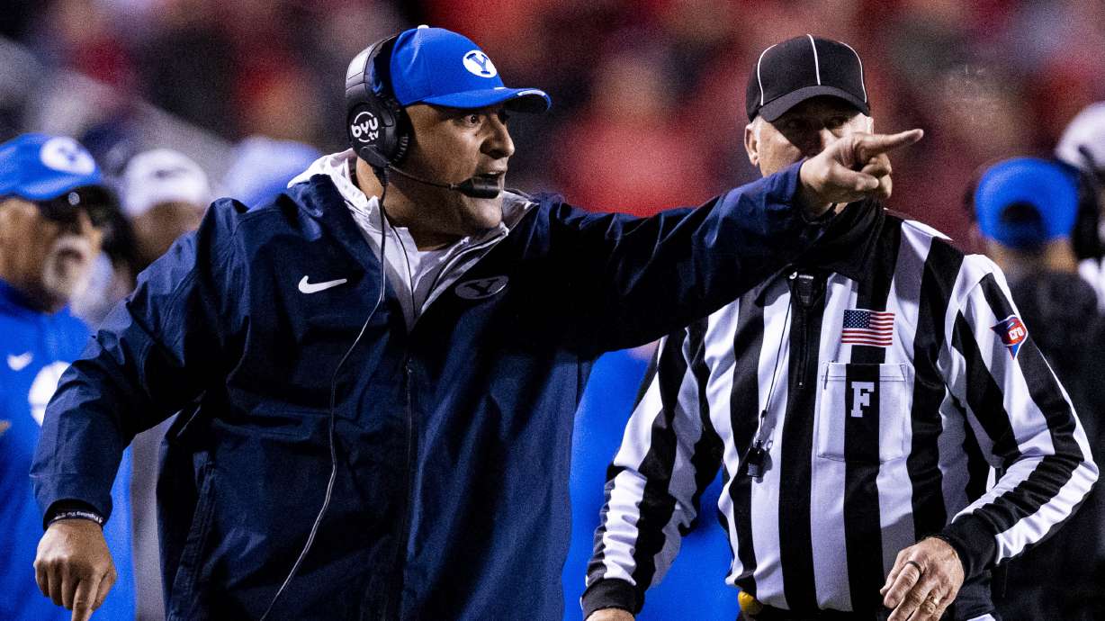 BYU football head coach Kalani Sitake calls out during a game between the University of Utah Utes and the Brigham Young University Cougars held at Rice-Eccles Stadium in Salt Lake City early on Sunday, Nov. 10, 2024.