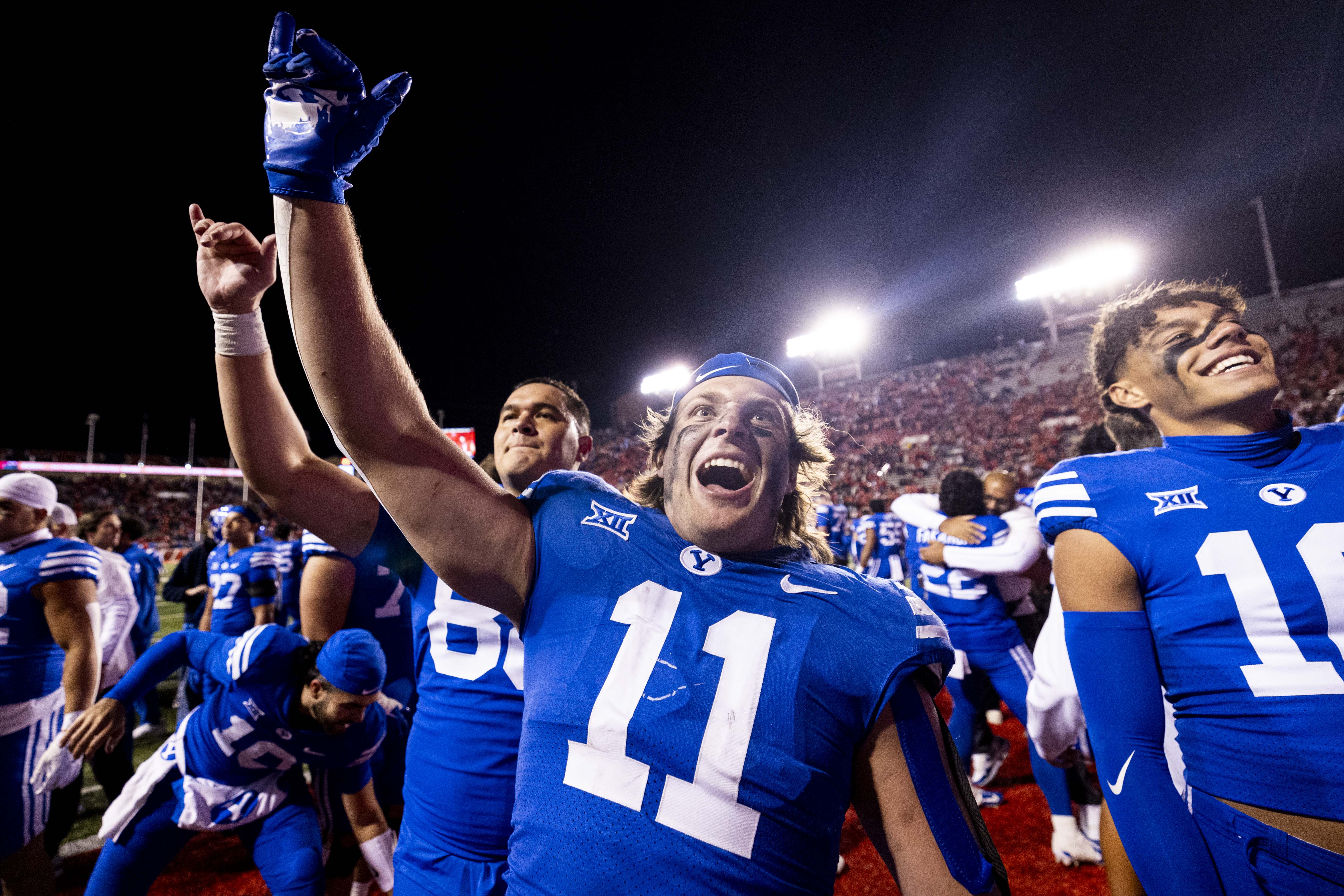 BYU linebacker Harrison Taggart (11) cheers after the Brigham Young University Cougars defeated the University of Utah Utes 22-21 at Rice-Eccles Stadium in Salt Lake City early on Sunday, Nov. 10, 2024.