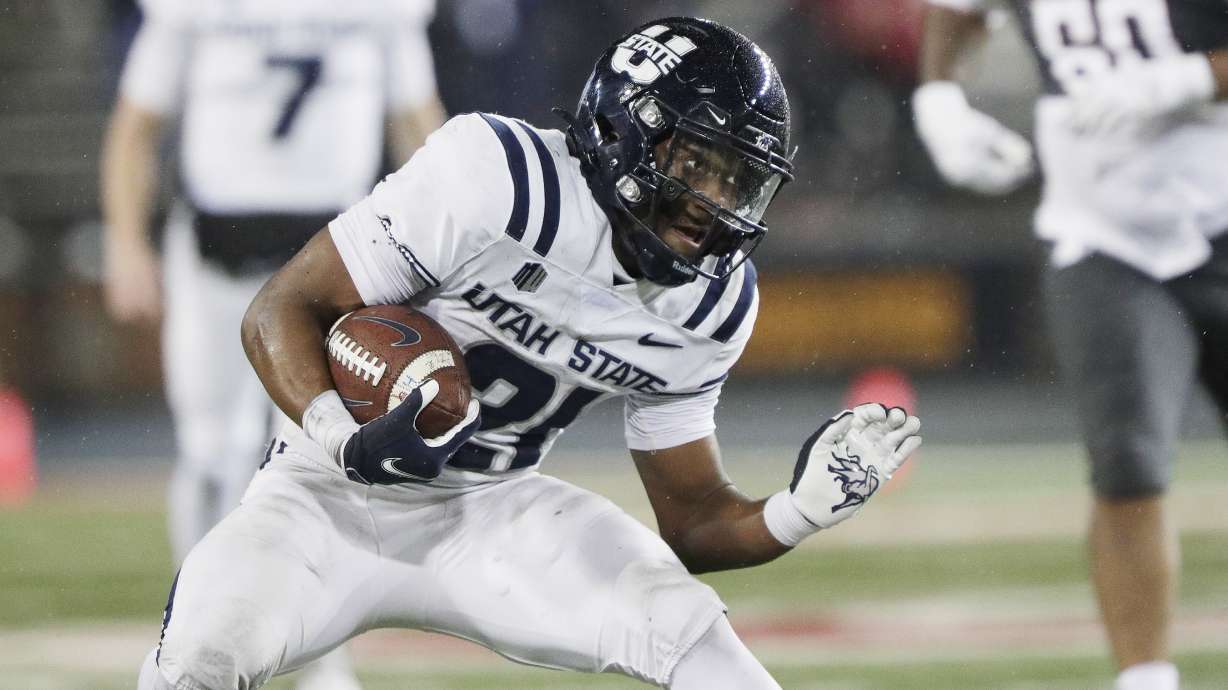 Utah State running back Herschel Turner carries the ball during the second half of an NCAA college football game against Washington State, Saturday, Nov. 9, 2024, in Pullman, Wash.