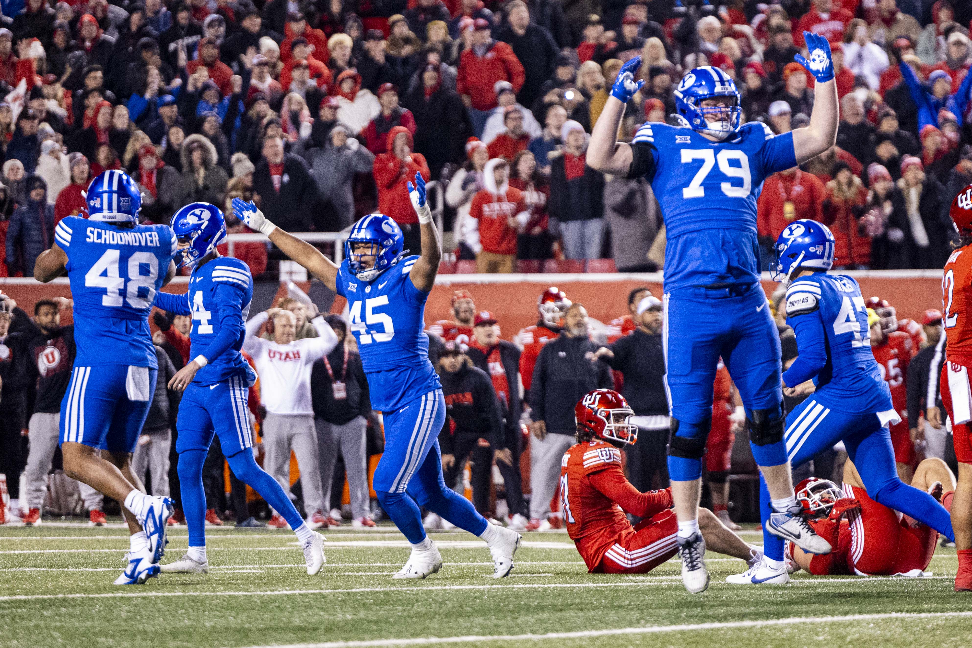 BYU defensive end Viliami Po'uha (45) and other Cougars celebrate after a field goal from place kicker Will Ferrin (44) gave BYU the lead at 22-21 during a game between the University of Utah Utes and the Brigham Young University Cougars held at Rice-Eccles Stadium in Salt Lake City early on Sunday, Nov. 10, 2024.