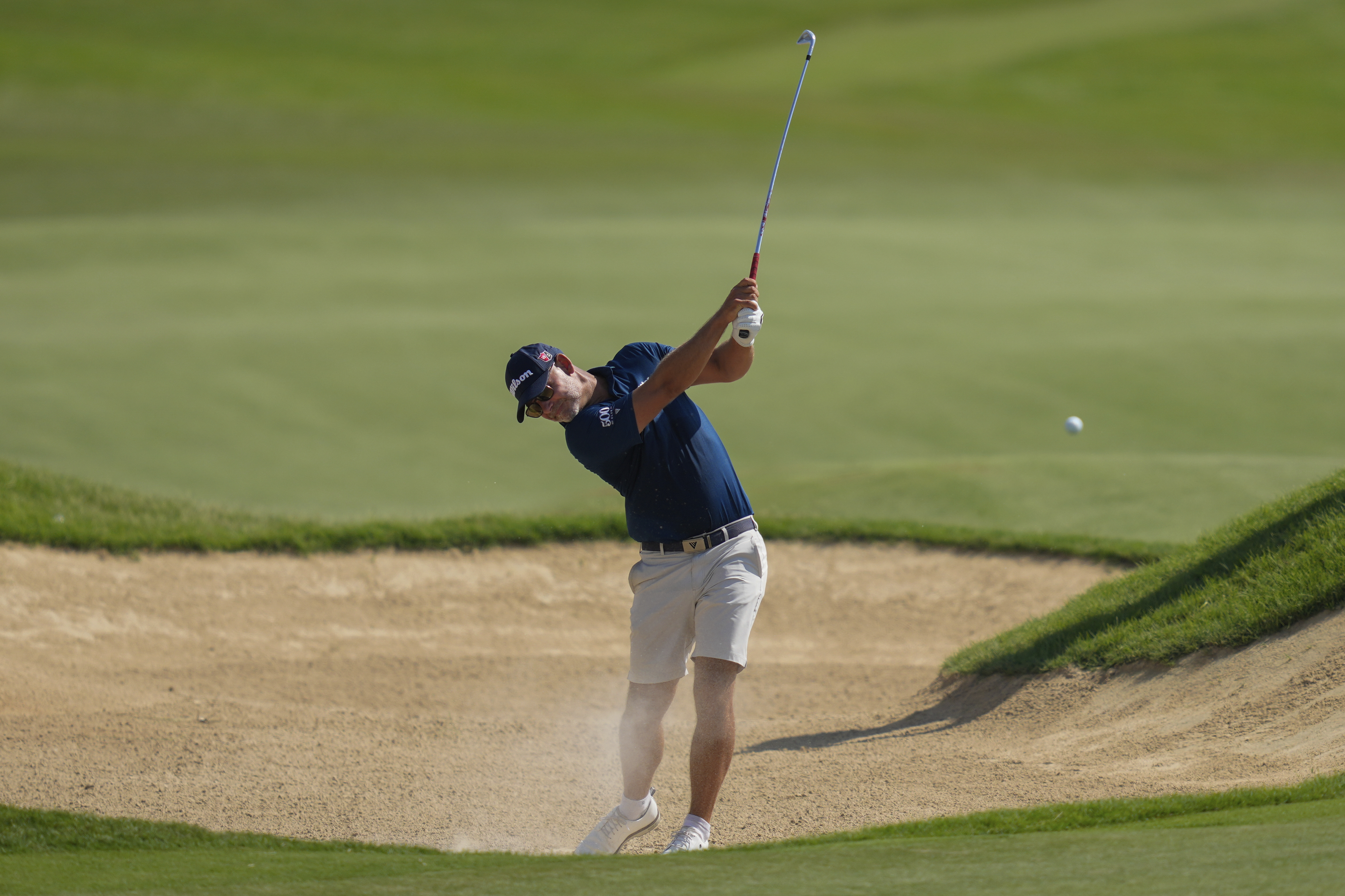Paul Waring of England plays his second shot on the 1st hole in the final round of Abu Dhabi Golf Championship in Abu Dhabi, United Arab Emirates, Sunday, Nov. 10, 2024.